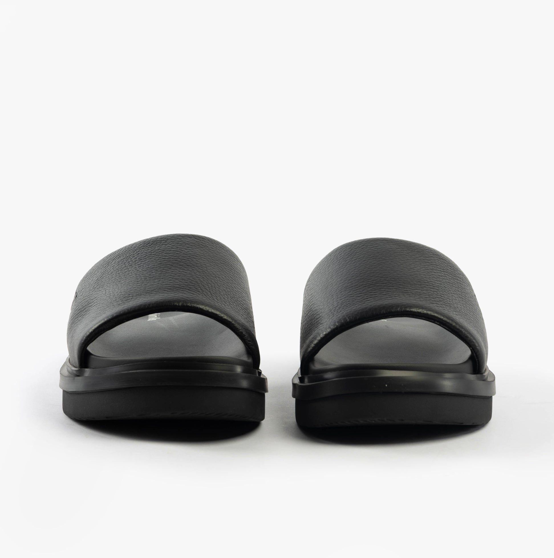 Calvin Klein FLAT MOLDED SLIDE Mens Triple Black front view showcasing sleek leather design and lightweight EVA sole.