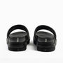 Calvin Klein FLAT MOLDED SLIDE Mens Triple Black rear view showing the lightweight slip-on design and leather upper.