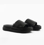 Calvin Klein FLAT MOLDED SLIDE Mens Triple Black side view showcasing leather upper and slip-on design.