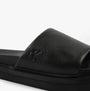 Calvin Klein FLAT MOLDED SLIDE Mens Triple Black detail view showing leather upper and logo.