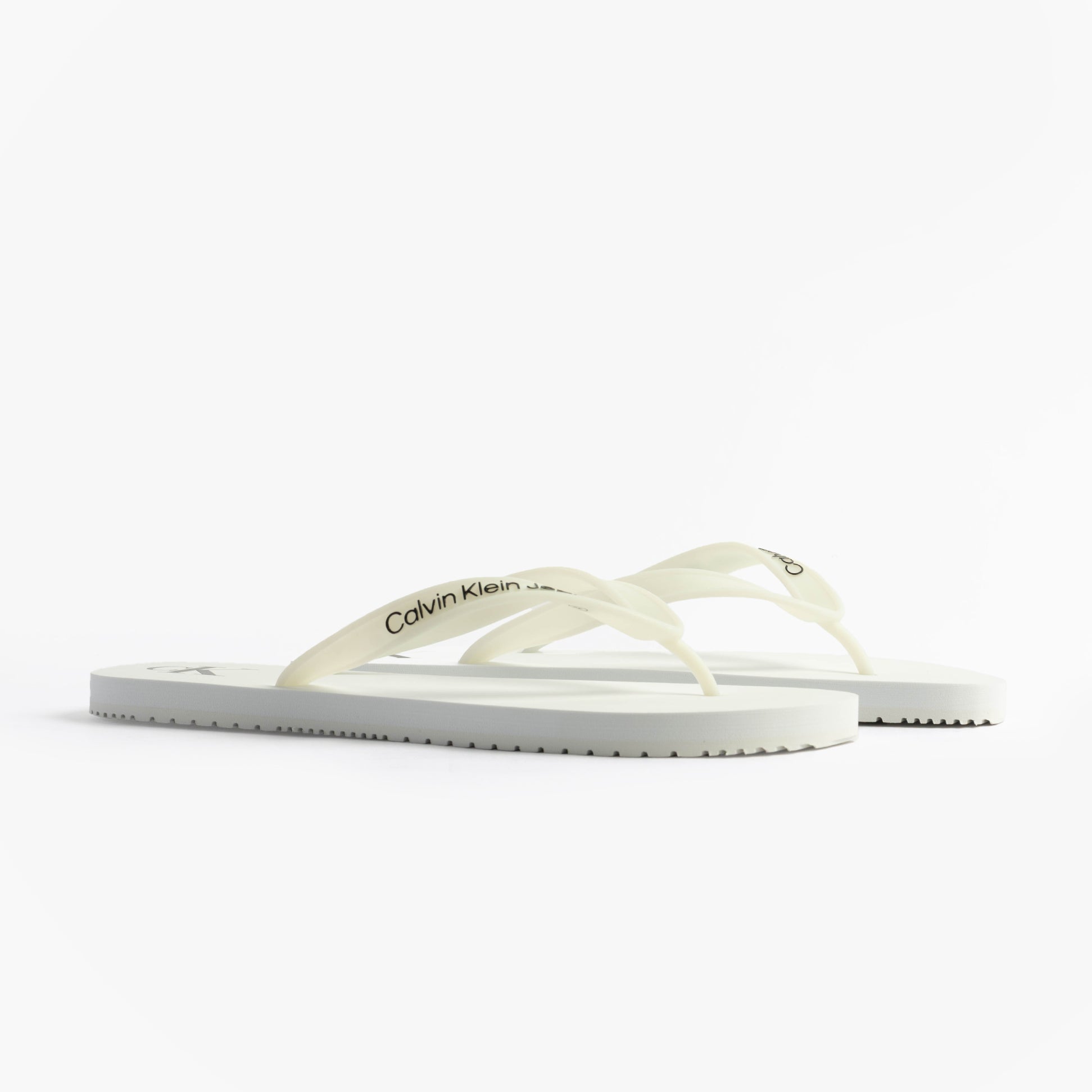Calvin Klein BEACH SANDAL TRANSPA Mens Sandals Bright White/Black side view featuring comfortable TPR upper and flat sole.