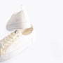Calvin Klein BOLD VULCANISED Womens Trainers Creamy White/White/Whisper Pink, side view, showcasing the lace-up design and branding.