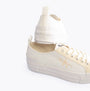 Calvin Klein BOLD VULCANISED Womens Trainers Creamy White/White/Whisper Pink side view showcasing canvas upper and platform sole.