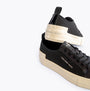 Calvin Klein BOLD VULCANISED Womens Trainers Black/Creamy White side view showcasing canvas upper and rubber sole.
