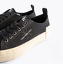 Calvin Klein BOLD VULCANISED Womens Trainers Black/Creamy White side view, showing lace-up detail and canvas upper.