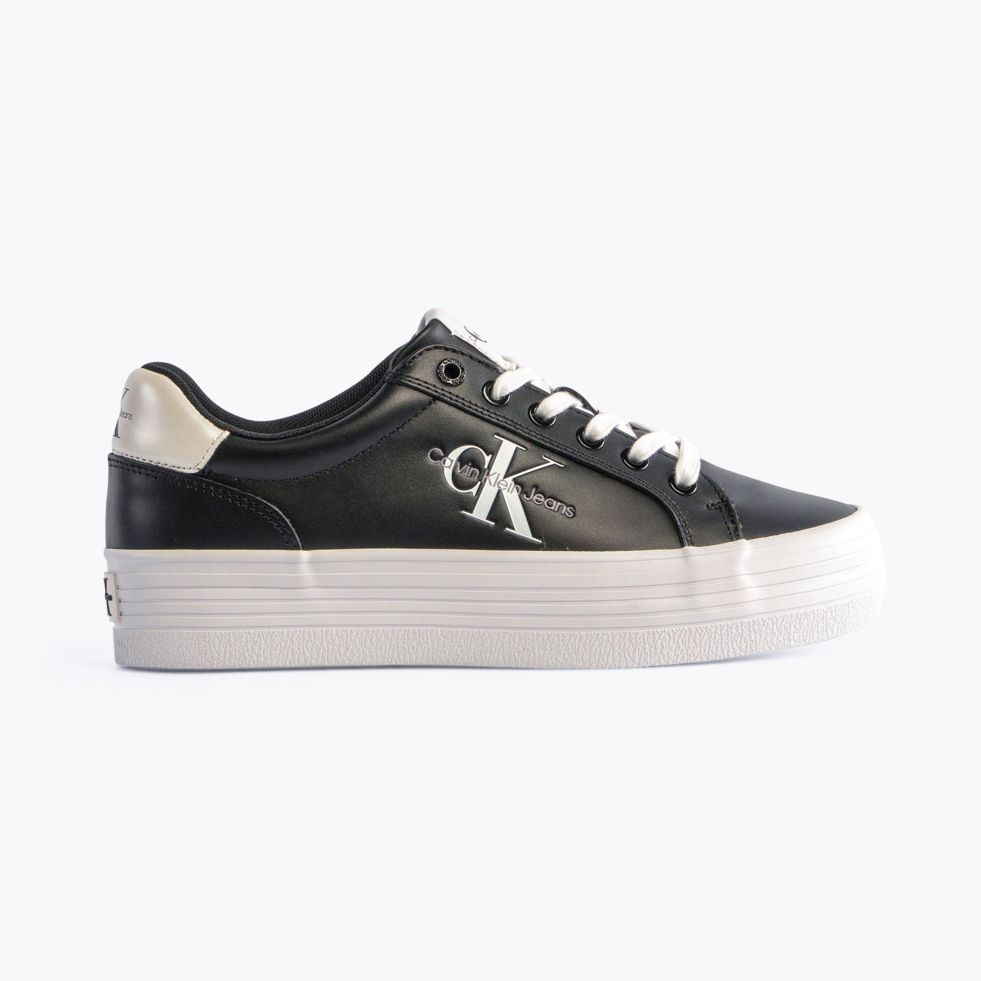 Calvin Klein FLATFORM LACEUP Womens Trainers Black/Bright White side view showing leather upper and platform sole.