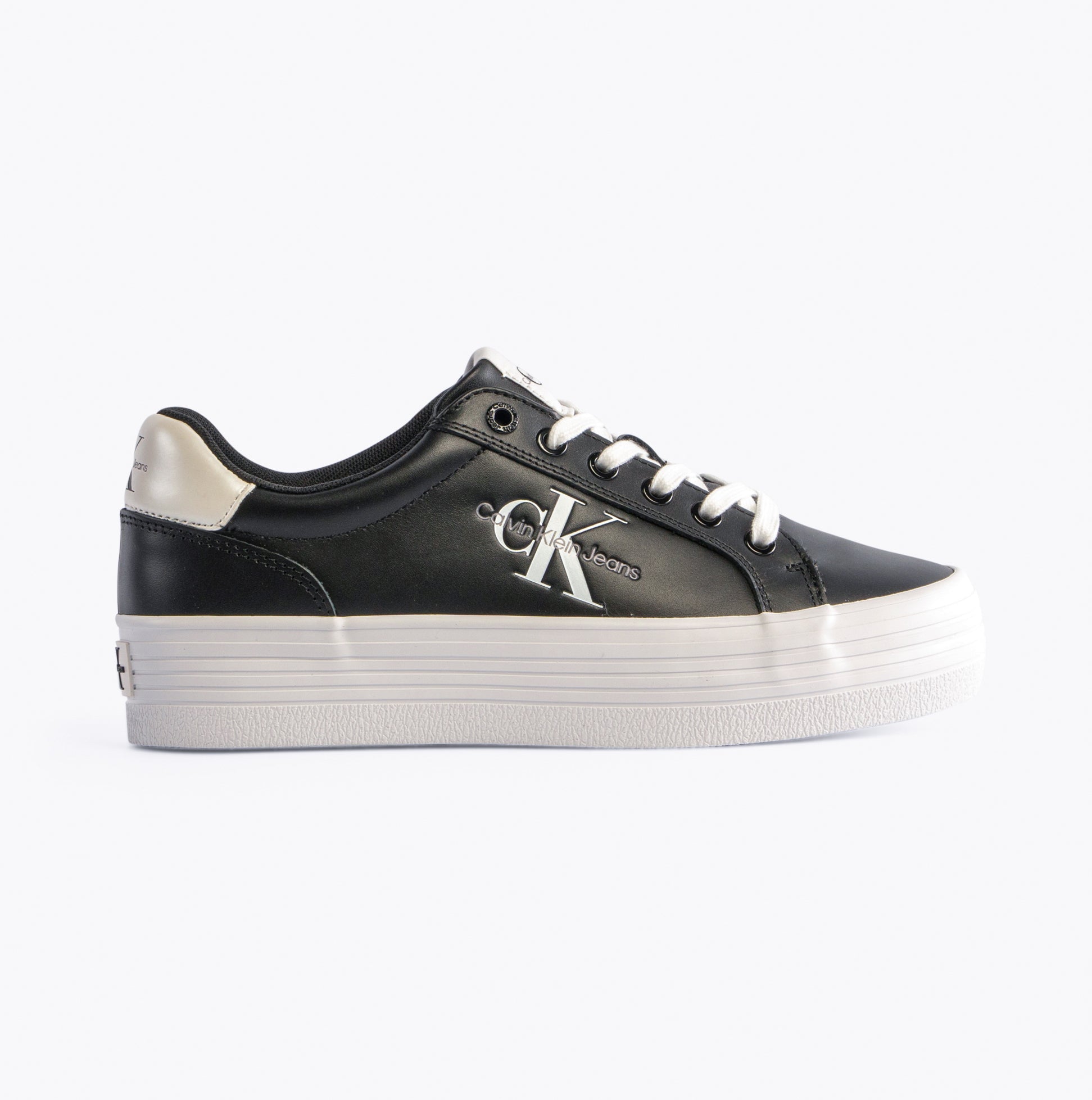 Calvin Klein FLATFORM LACEUP Womens Trainers Black/Bright White side view showing leather upper and platform sole.