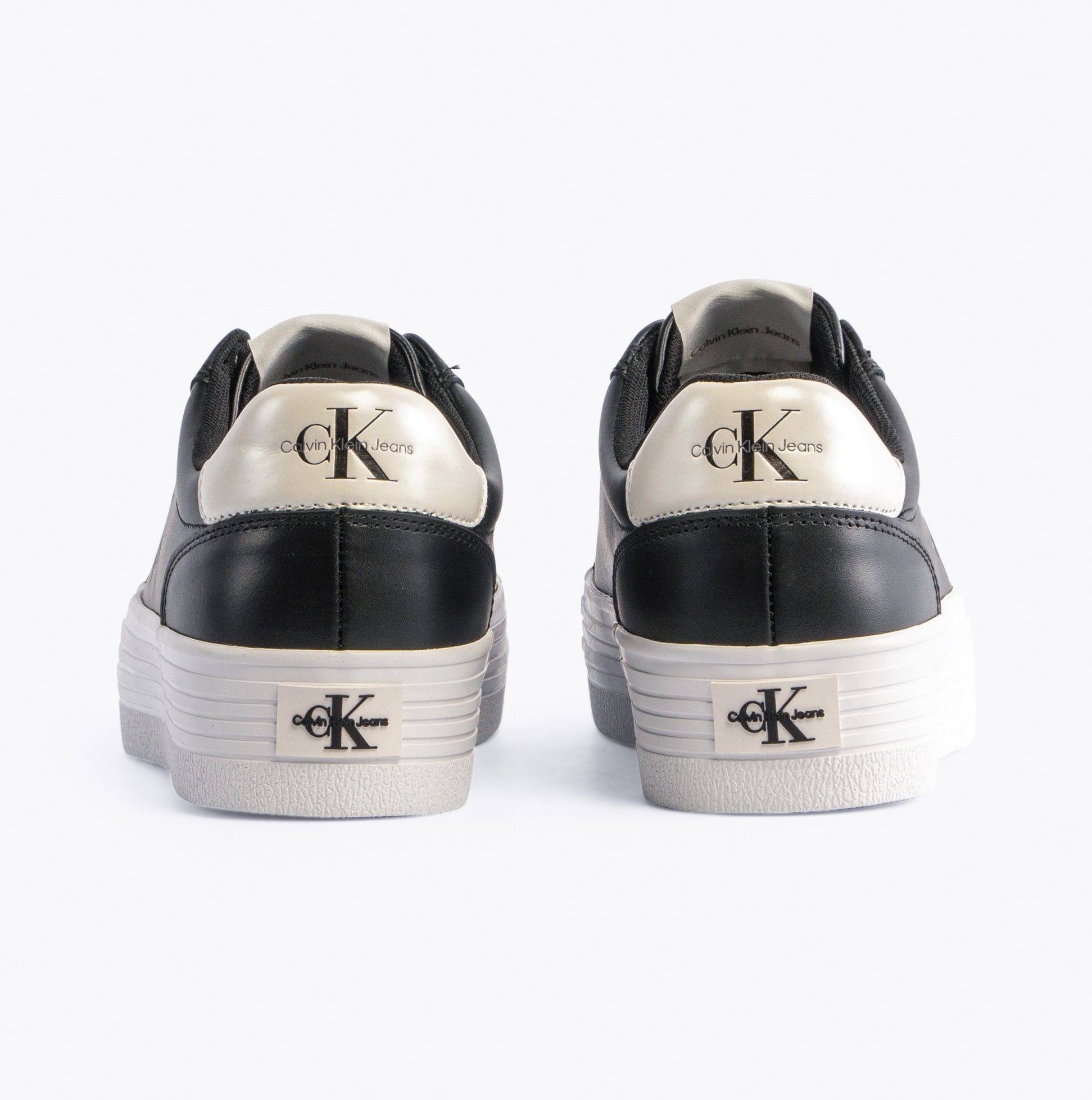Calvin Klein FLATFORM LACEUP Womens Trainers Black/Bright White rear view showcasing logo and platform sole.