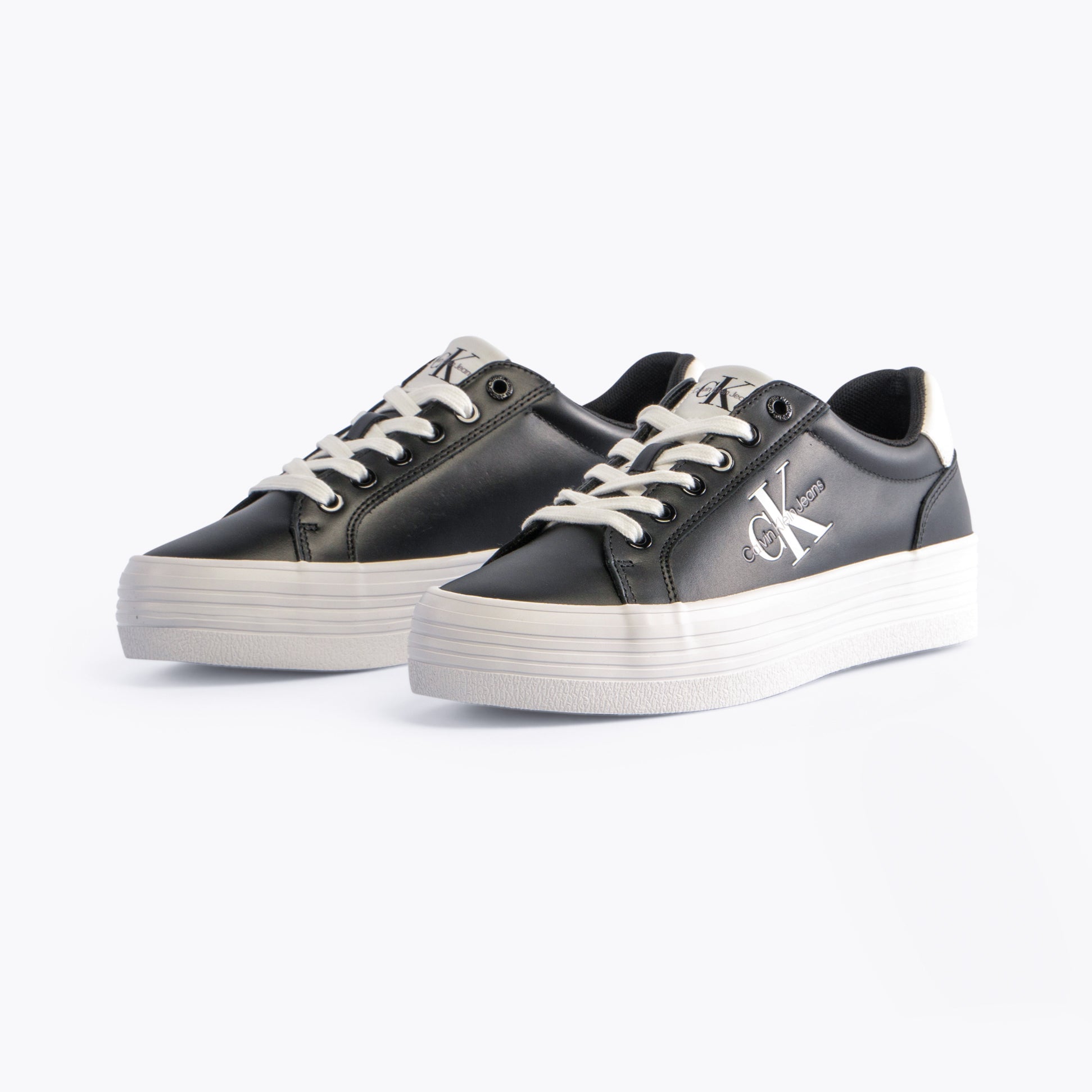 Calvin Klein FLATFORM LACEUP Womens Trainers Black/Bright White side view showcasing casual leather design and platform sole.
