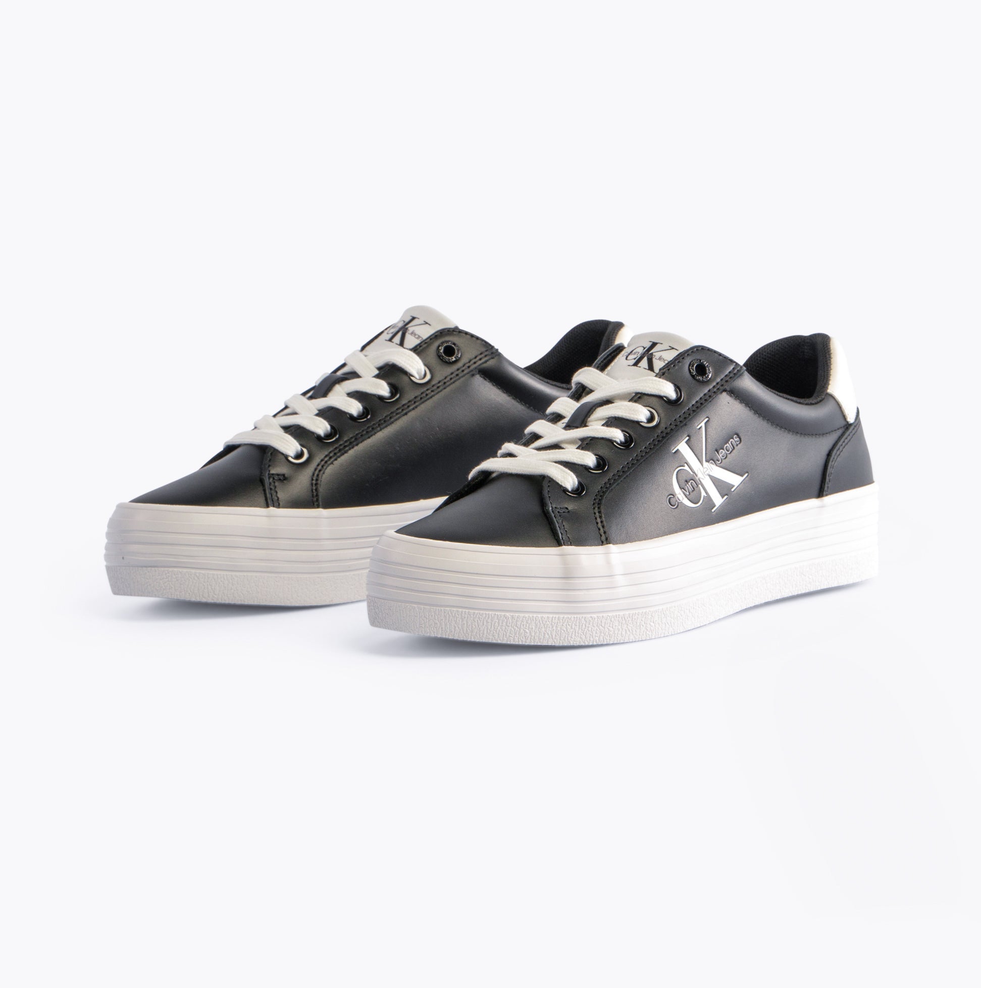 Calvin Klein FLATFORM LACEUP Womens Trainers Black/Bright White side view showcasing casual leather design and platform sole.