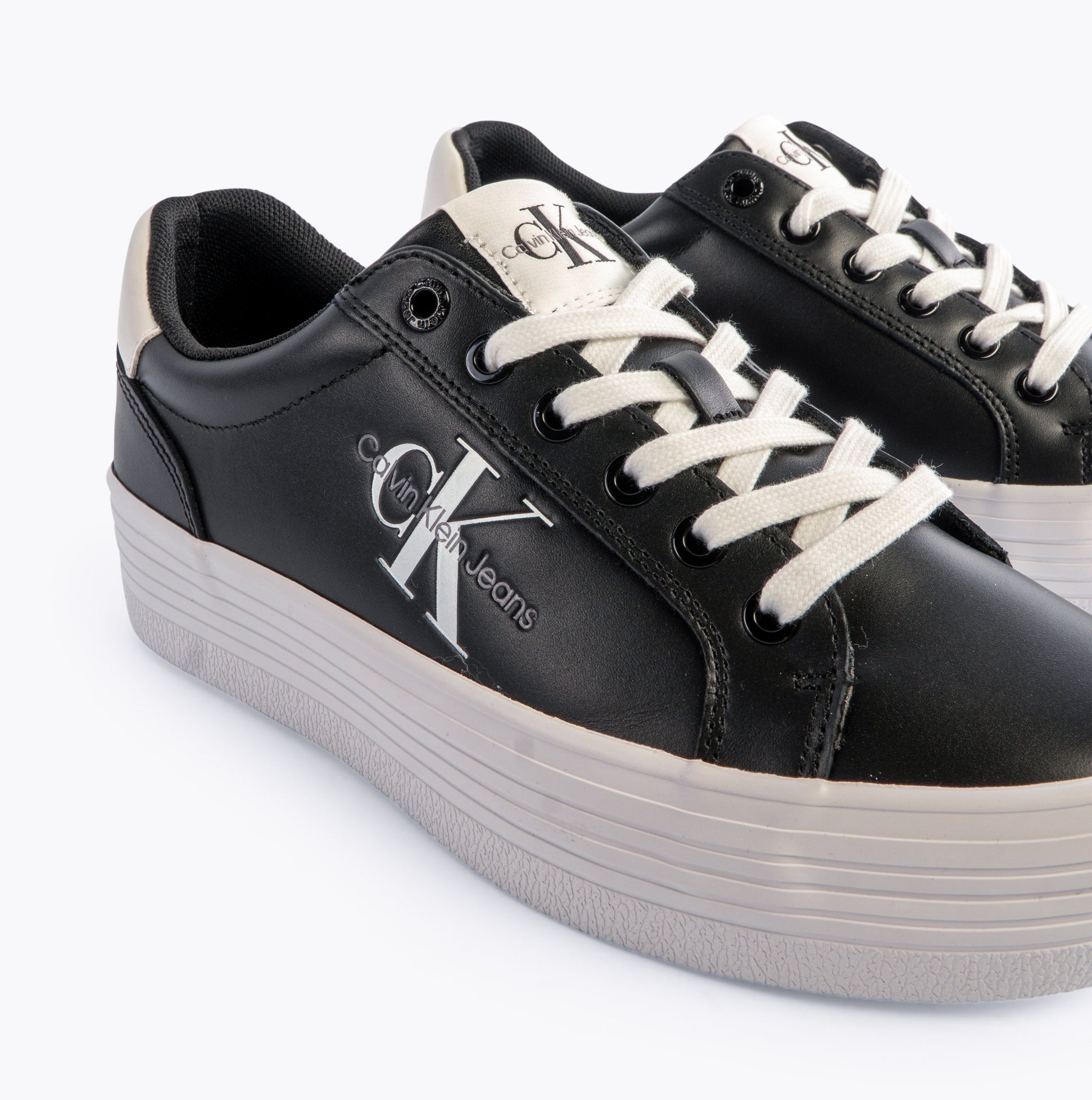 Calvin Klein FLATFORM LACEUP Womens Trainers Black/Bright White side view showing sleek design and lace-up closure.