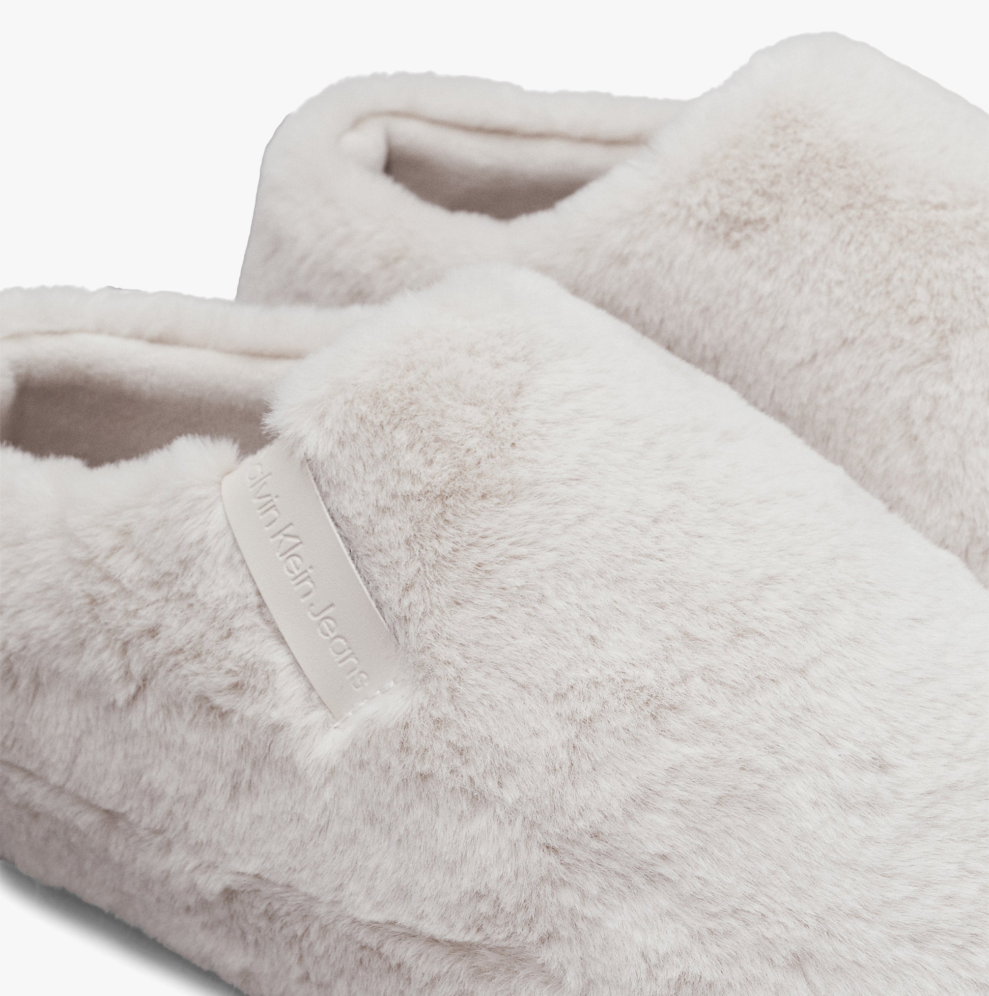 Calvin Klein HOME ANKLE Womens Slippers Triple Eggshell detail view, featuring soft faux fur upper and round toe.