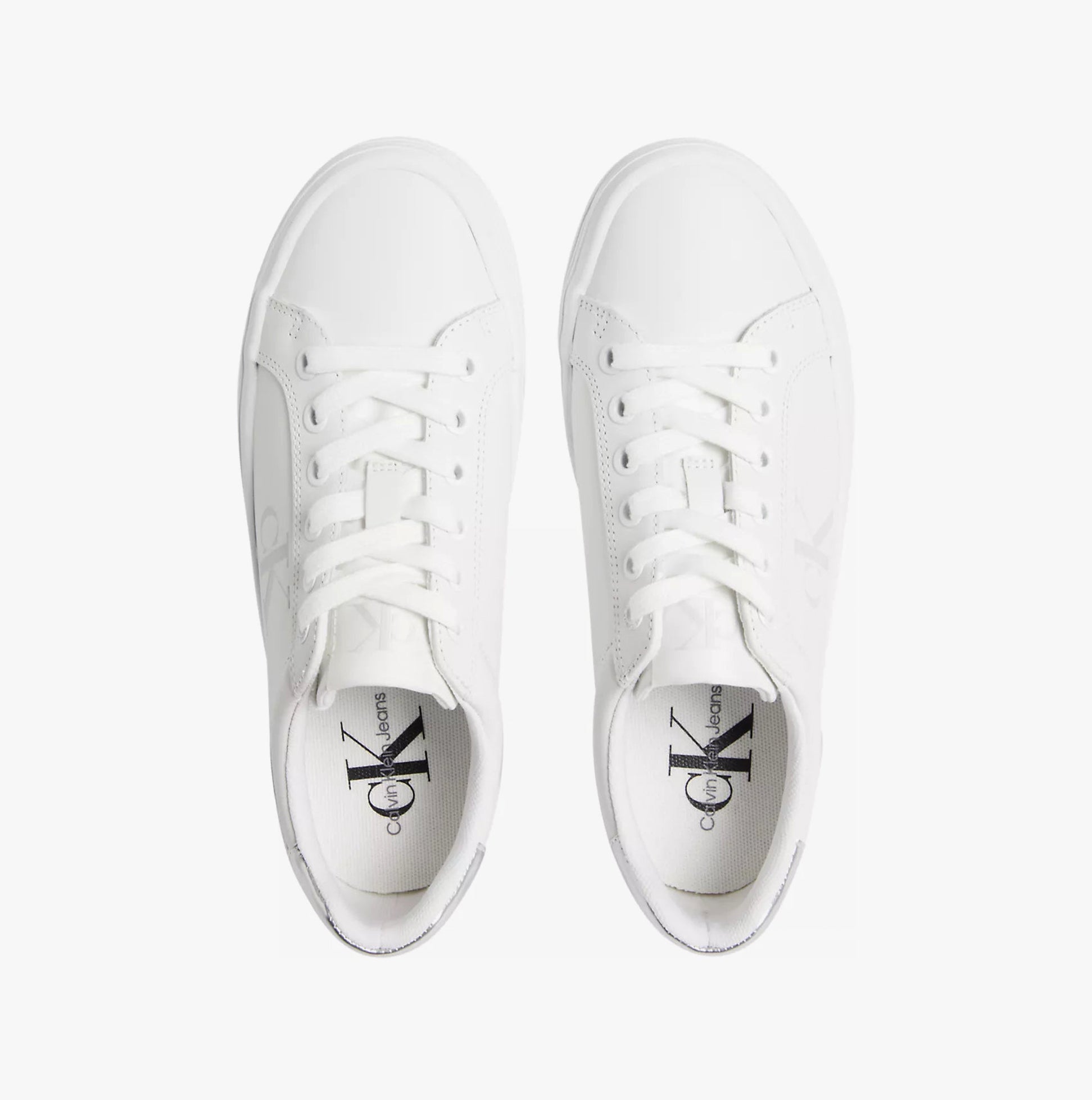 Calvin Klein BOLD VULCANISED FLATFORM Womens Trainers Bright White/Silver top view showcasing lace-up design and sleek white leather.