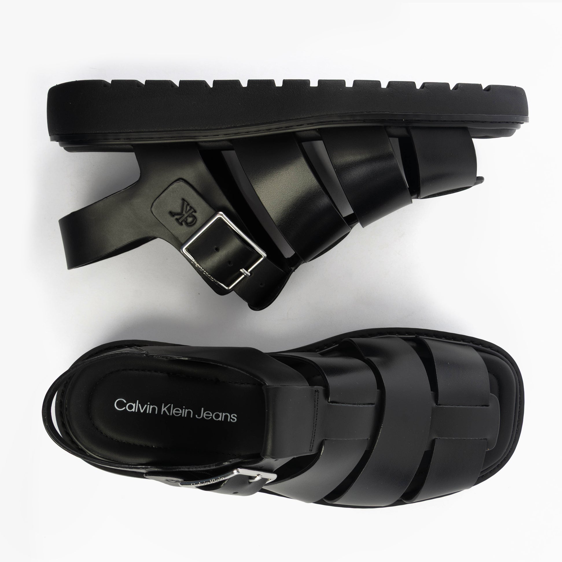 Calvin Klein LEATHER FISHERMAN Womens Sandals Triple Black top view and side view showcasing buckle and flat sole.