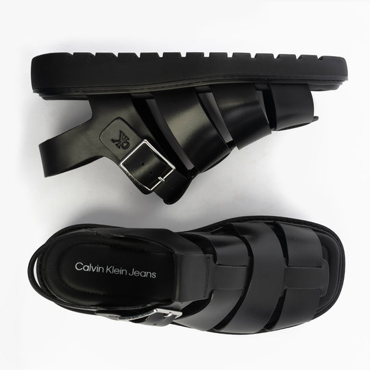 Calvin Klein LEATHER FISHERMAN Womens Sandals Triple Black top view and side view showcasing buckle and flat sole.