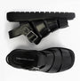 Calvin Klein LEATHER FISHERMAN Womens Sandals Triple Black top view and side view showcasing buckle and flat sole.