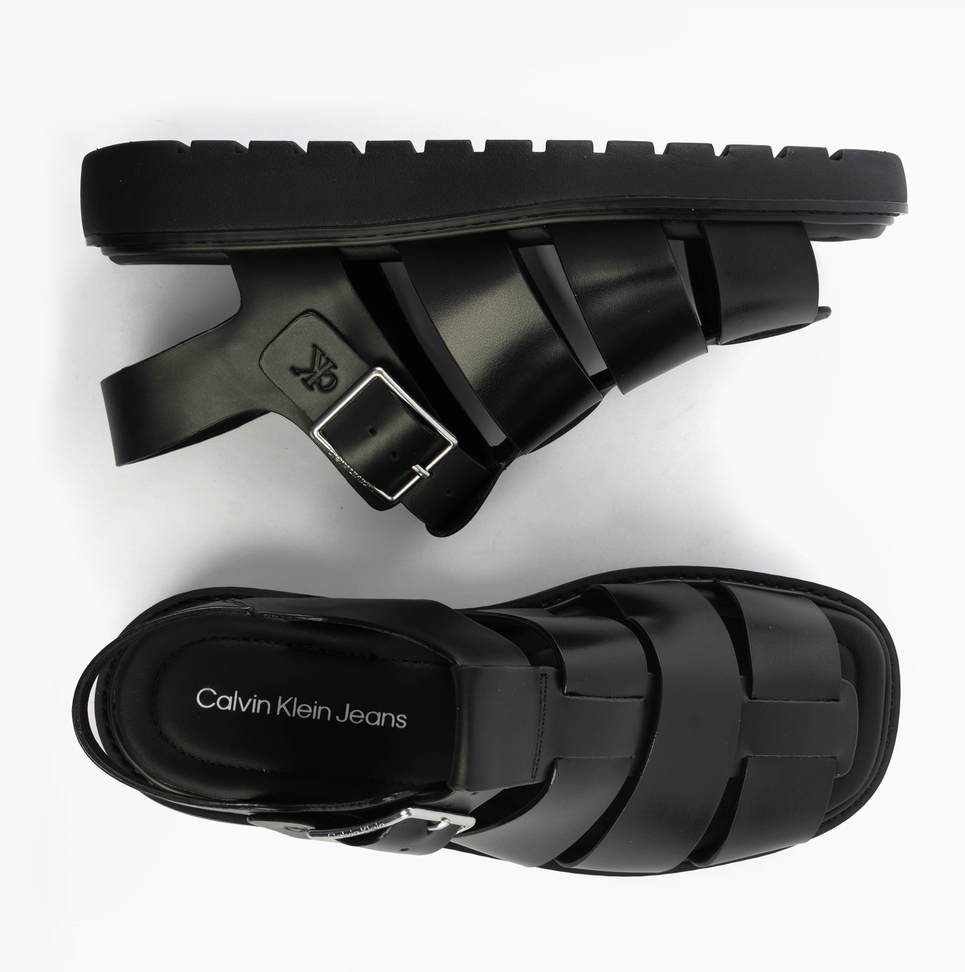 Calvin Klein LEATHER FISHERMAN Womens Sandals Triple Black top view and side view showcasing buckle and flat sole.