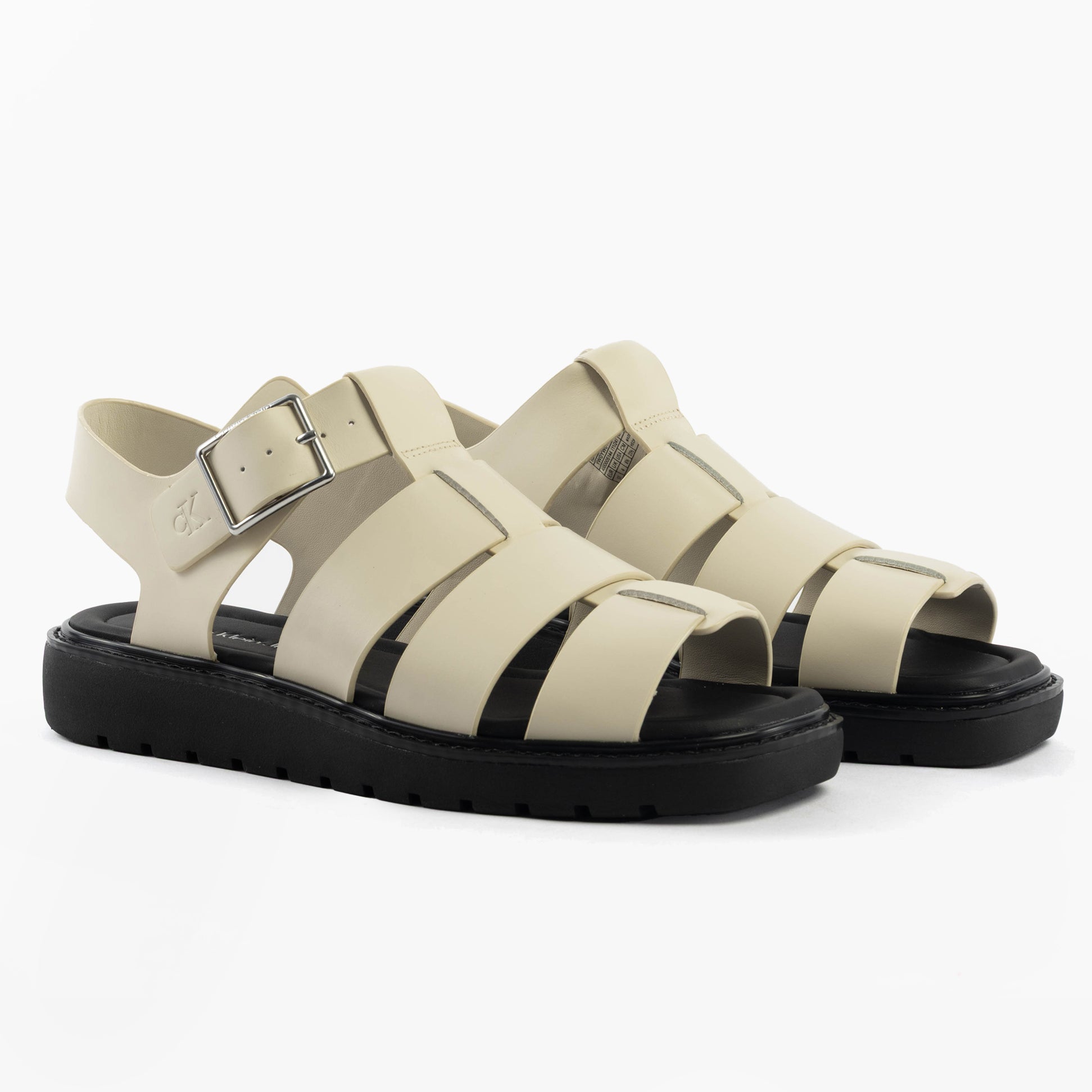 Calvin Klein LEATHER FISHERMAN Womens Sandals Turtle Dove/Black side view showing stylish leather design and buckle closure.