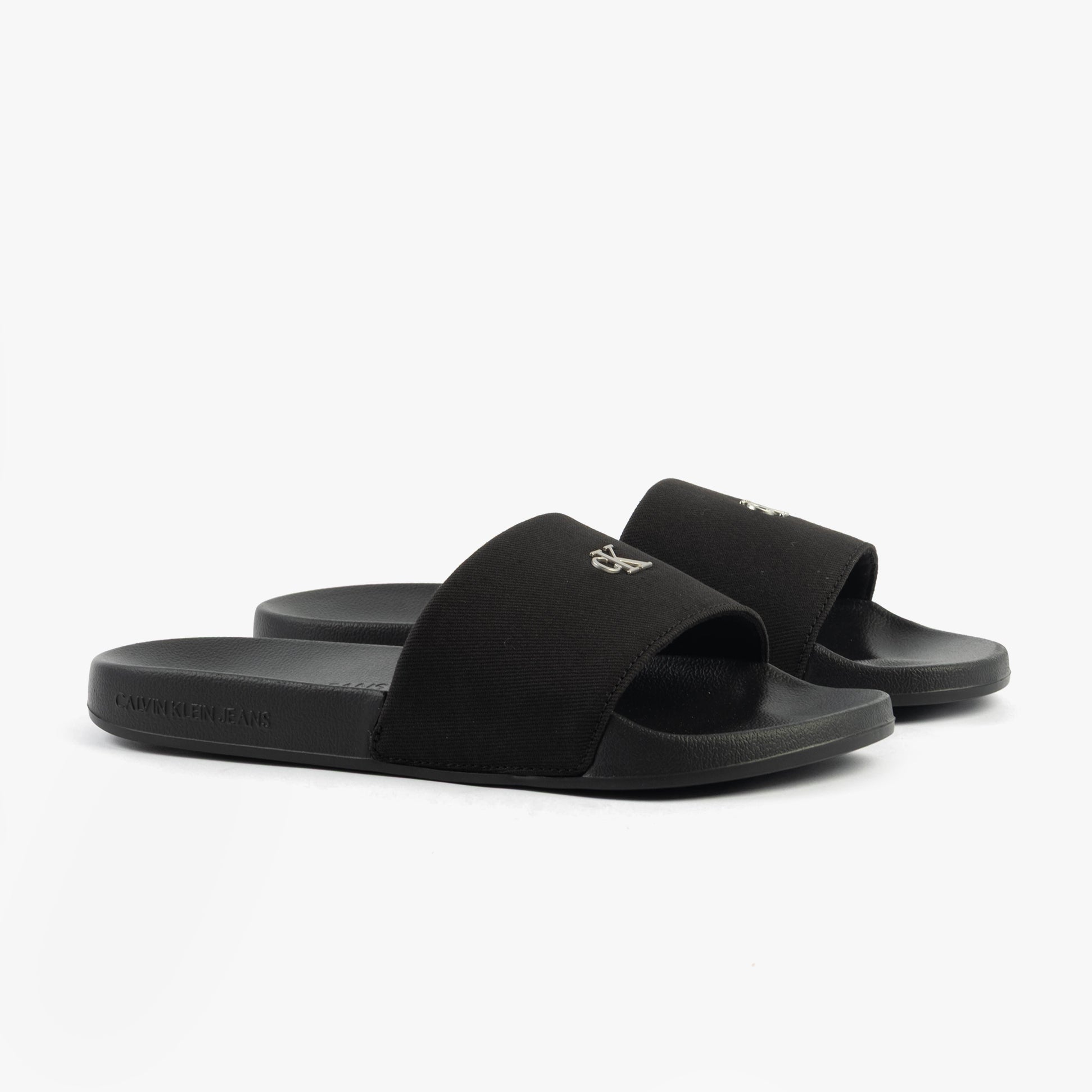 Calvin Klein MONOGRAM Womens Slides Triple Black side view showcasing the slip-on design and lightweight comfort.