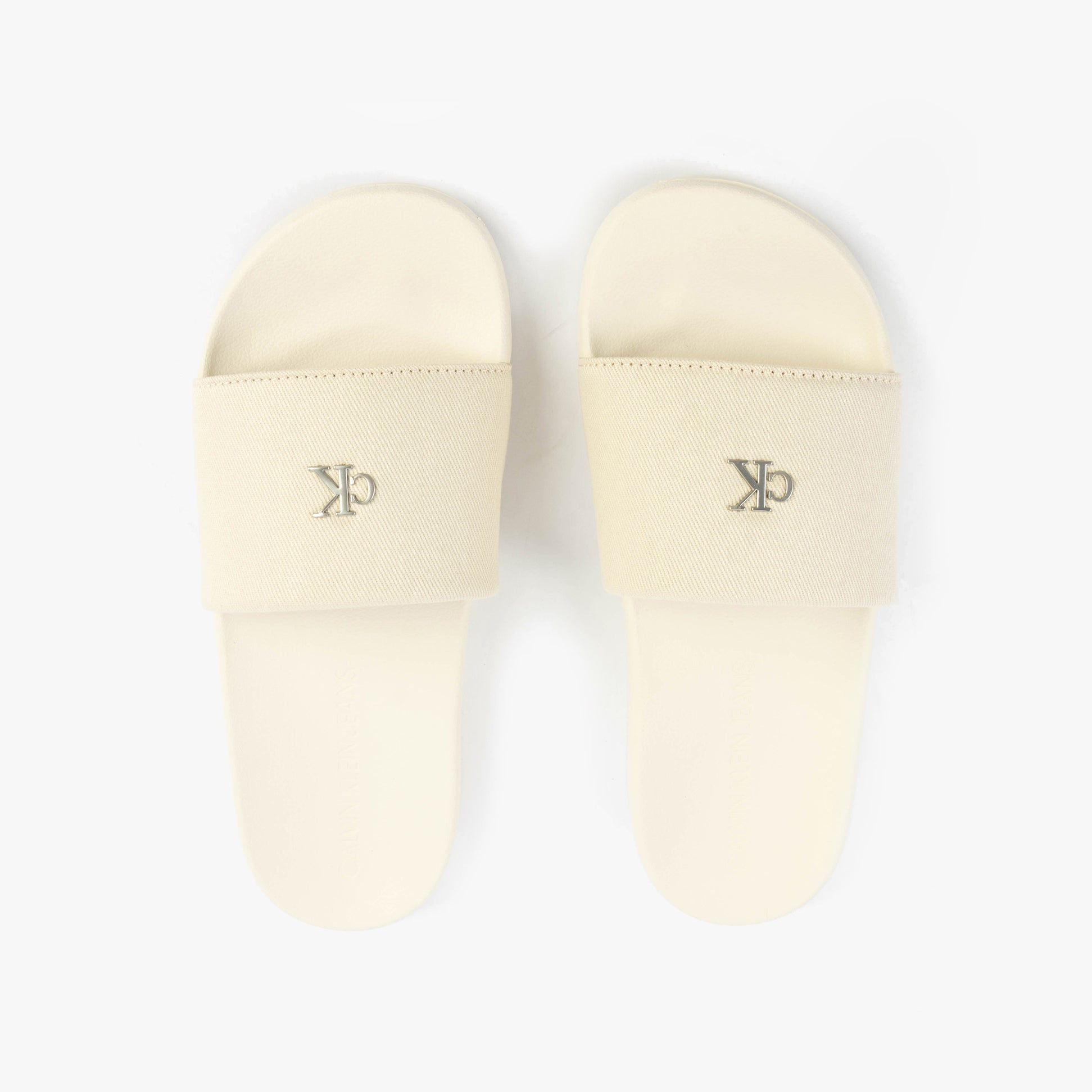 Calvin Klein MONOGRAM Womens Slides Turtle Dove top view showcasing beige color and logo.