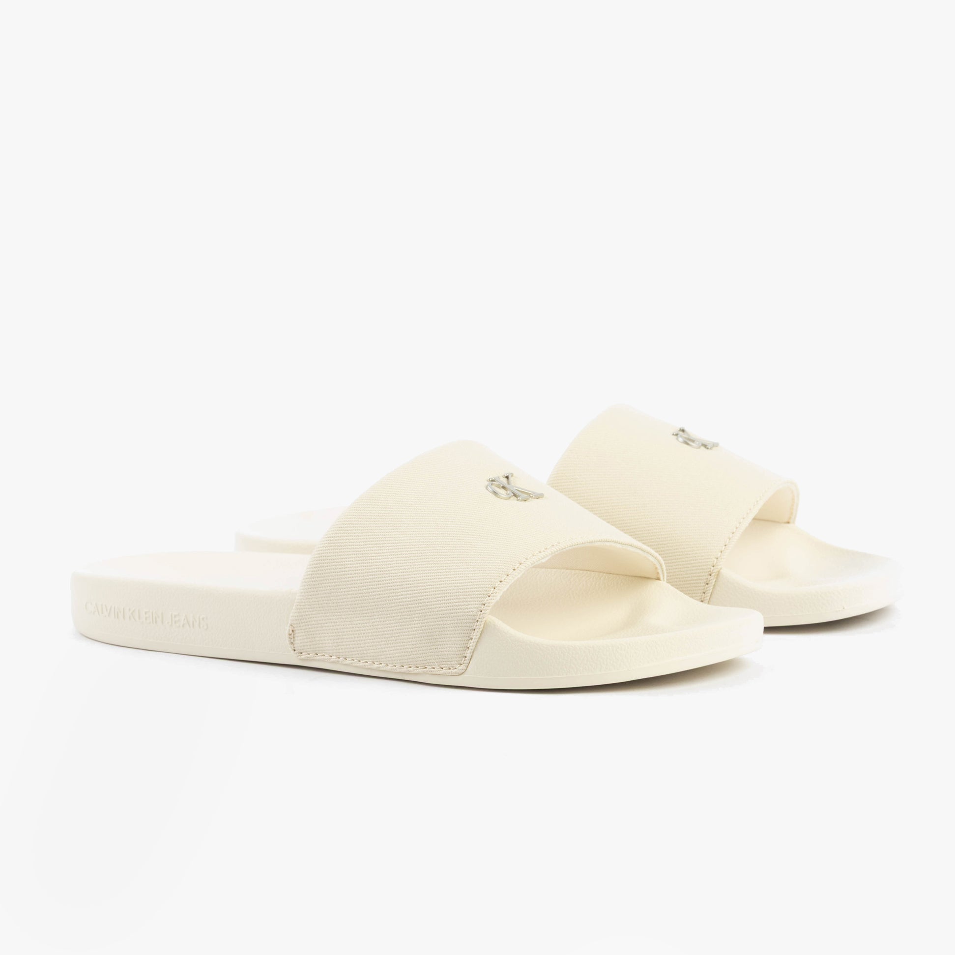 Calvin Klein MONOGRAM Womens Slides Turtle Dove side view showing light cotton upper and comfortable slip-on design.