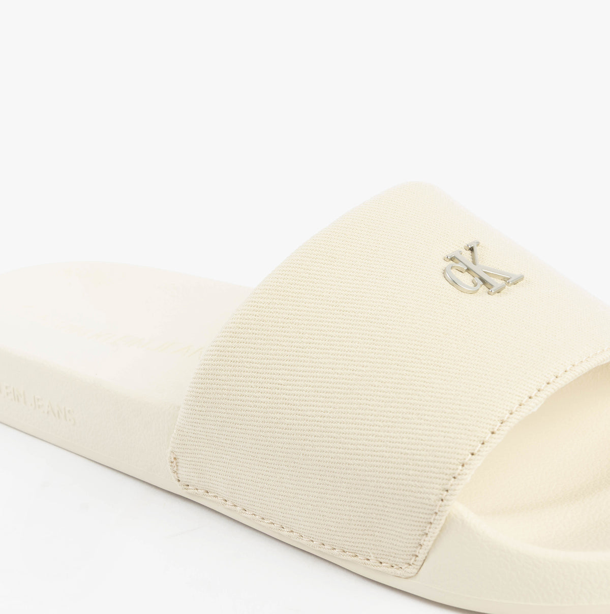 Calvin Klein MONOGRAM Womens Slides Turtle Dove side view with logo detail on the strap, showcasing comfort and style.