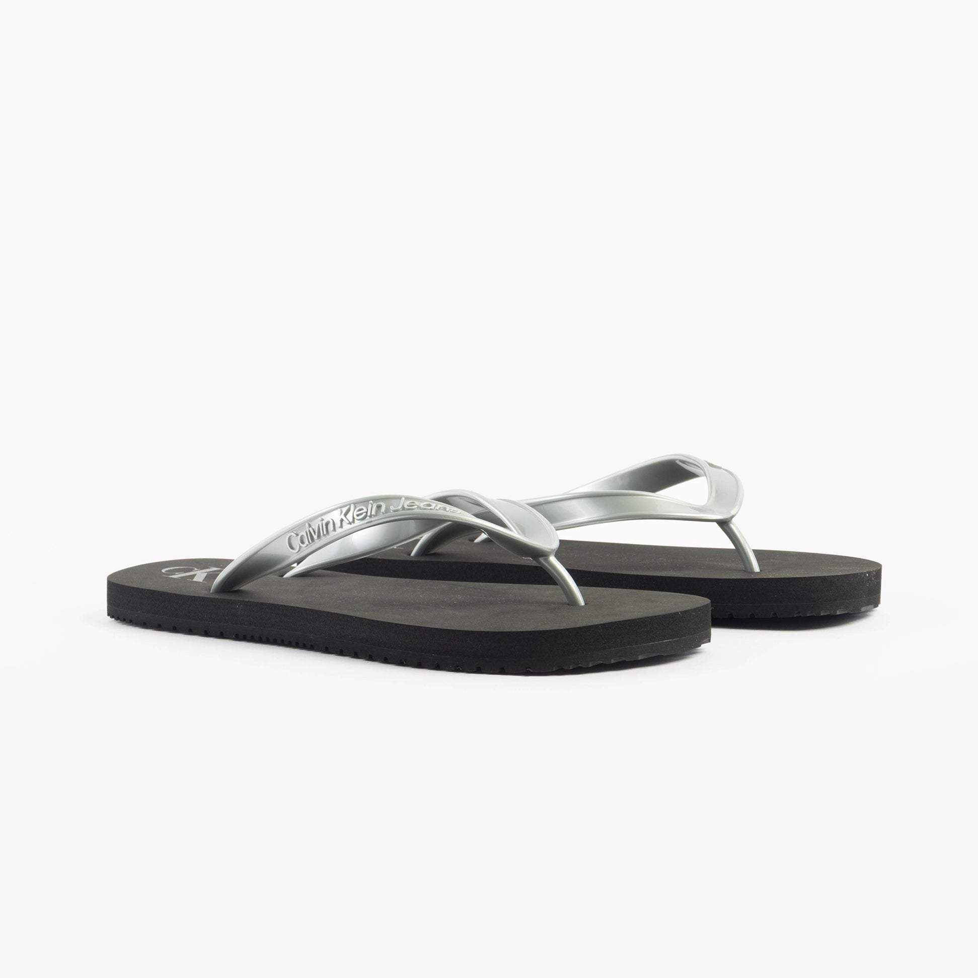 Calvin Klein BEACH SANDAL MONOLOG Womens Sandals Black/Silver side view showcasing the sleek design and comfortable fit.