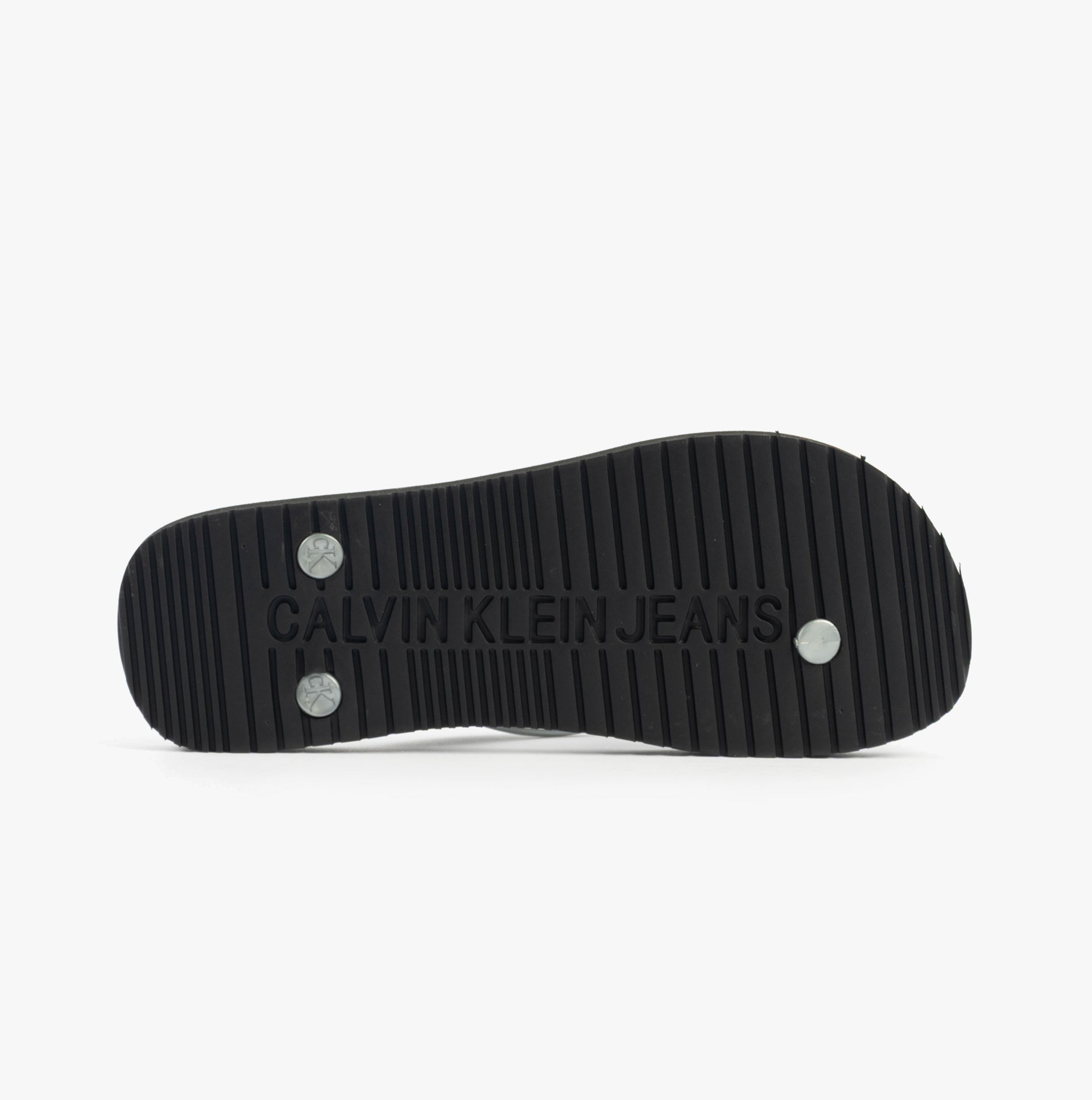 Calvin Klein BEACH SANDAL MONOLOG Womens Sandals Black/Silver bottom view showing rubber sole with logo detail.