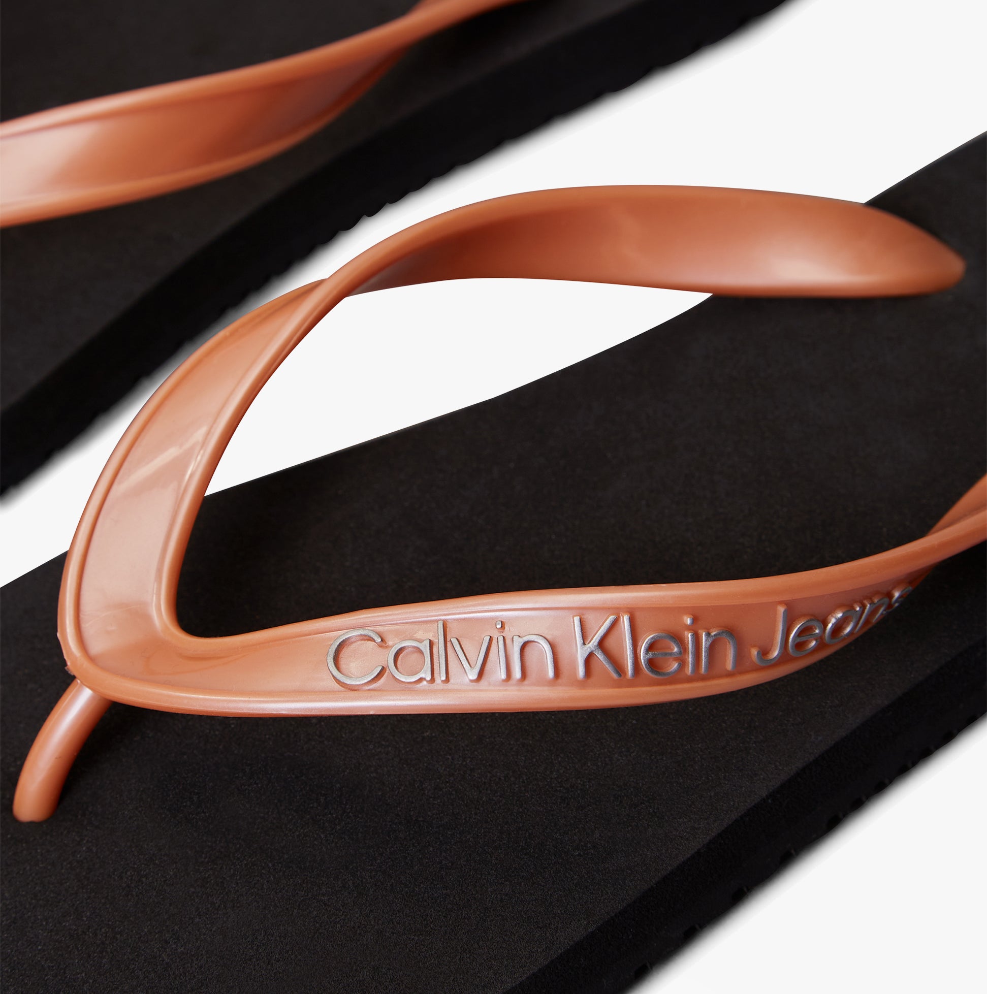 Calvin Klein BEACH SANDAL MONOLOGUE Womens Flip Flops Black/Dusty Coral close-up of straps detail view