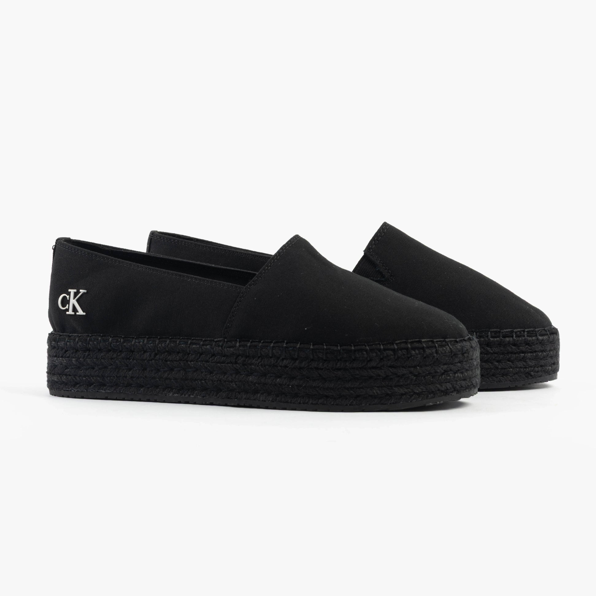 Calvin Klein FLATFORM Espadrille Womens Canvas & Plimsolls Triple Black side view showing slip-on design and platform sole.