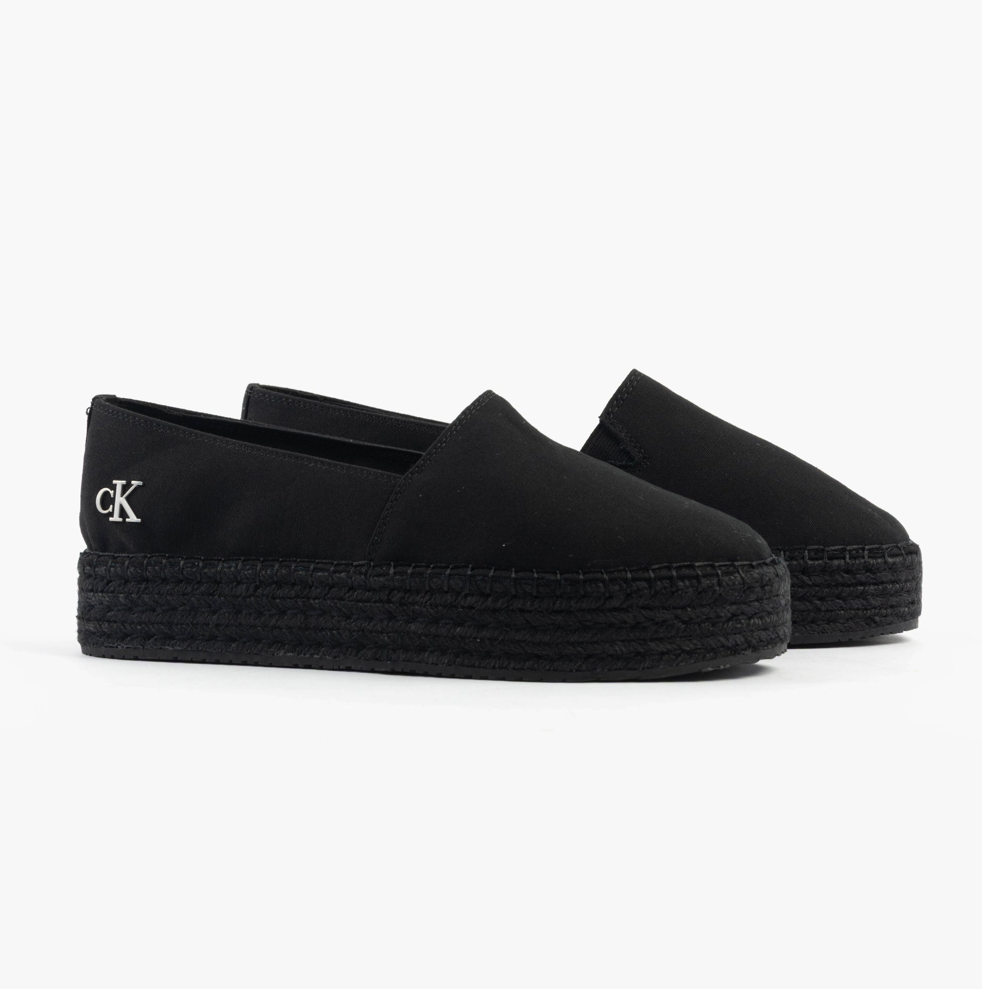 Calvin Klein FLATFORM Espadrille Womens Canvas & Plimsolls Triple Black side view showing slip-on design and platform sole.