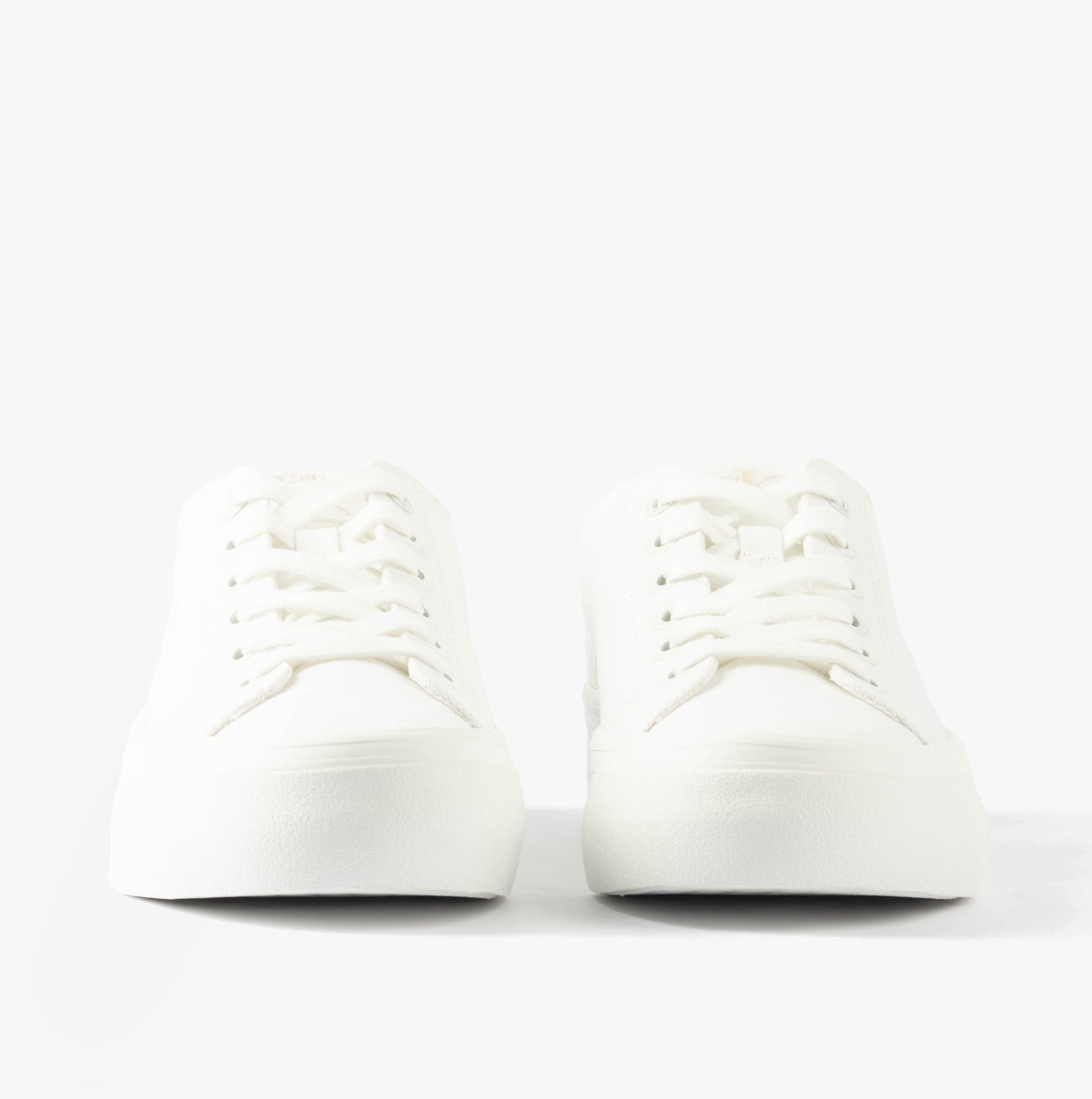 Calvin Klein VULC FLATFORM LOW Womens Trainers Triple Bright White front view showcasing lace-up closure and round toe.