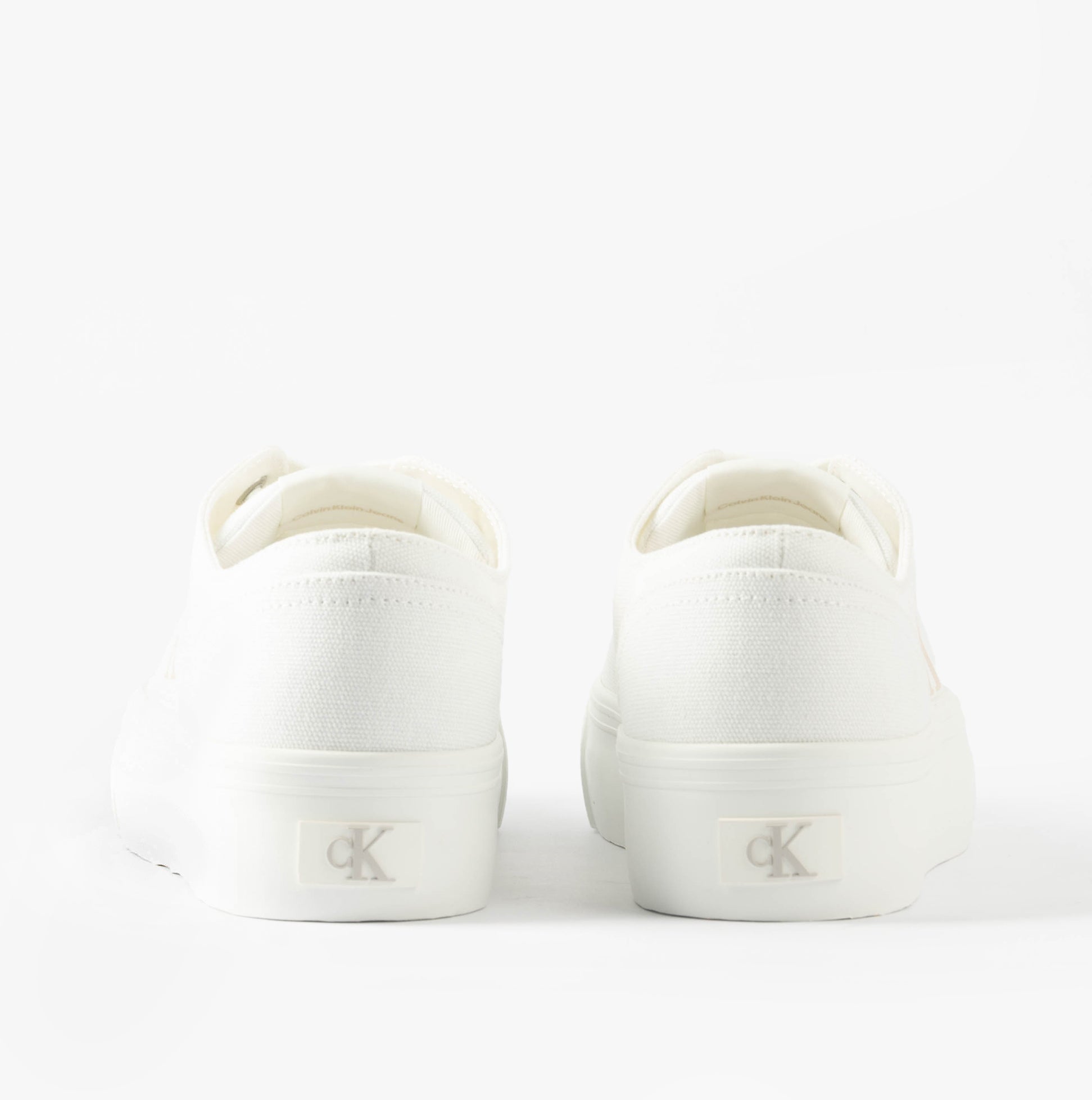 Calvin Klein VULC FLATFORM LOW Womens Trainers Triple Bright White back view showcasing sleek design and logo detail.