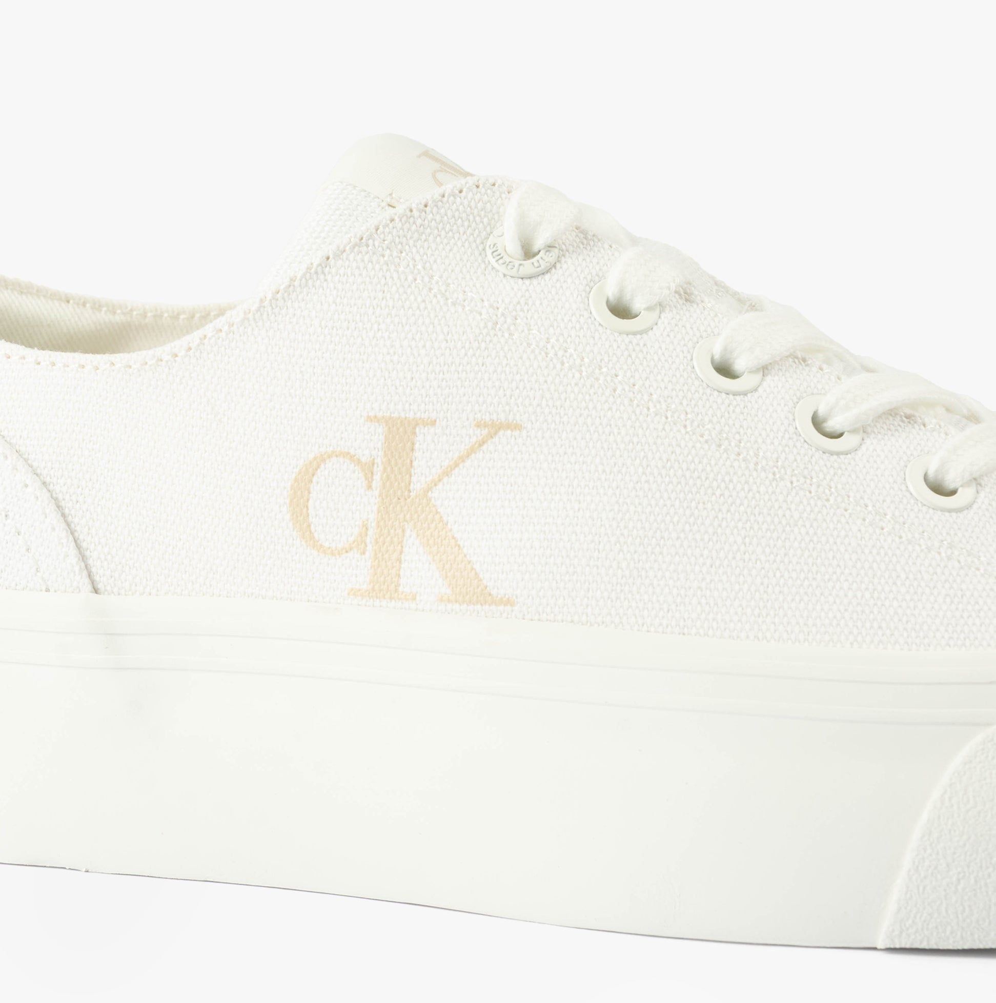 Calvin Klein VULC FLATFORM LOW Womens Trainers Triple Bright White detail view showcasing canvas upper and logo.