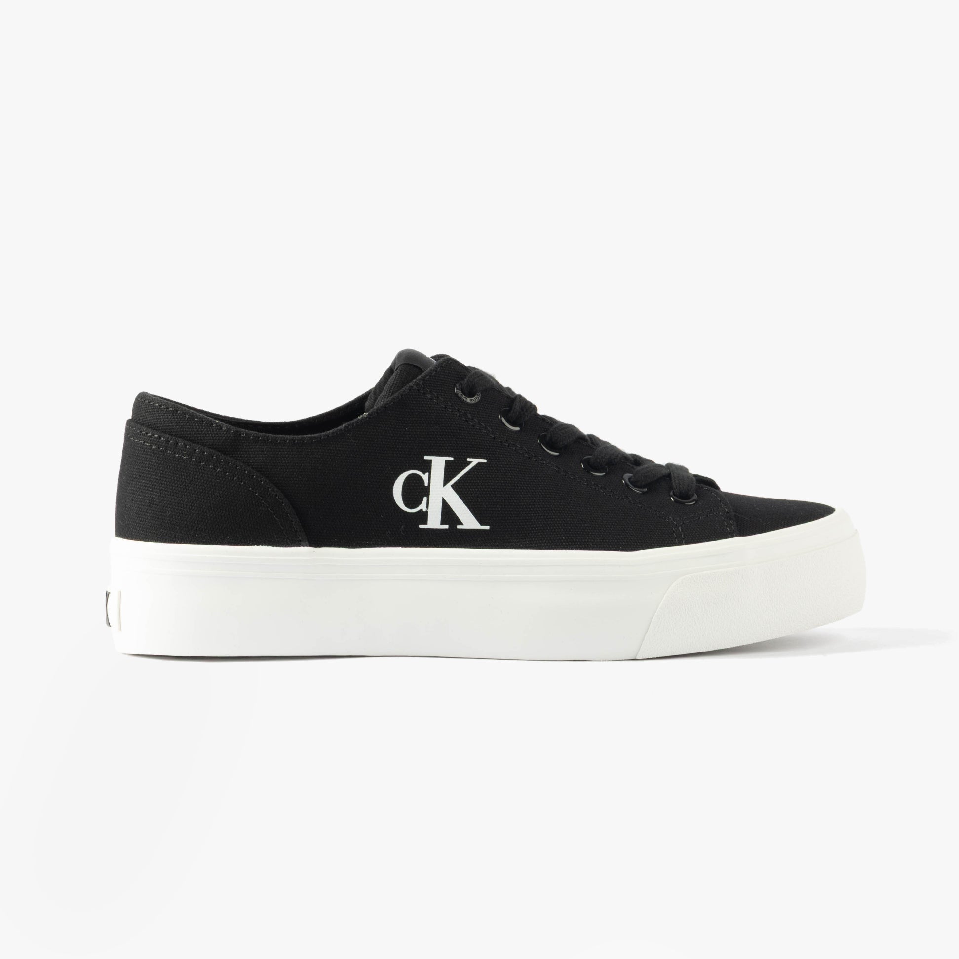 Calvin Klein VULC FLATFORM LOW Womens Trainers Black/Bright White side view featuring black canvas upper and white sole.