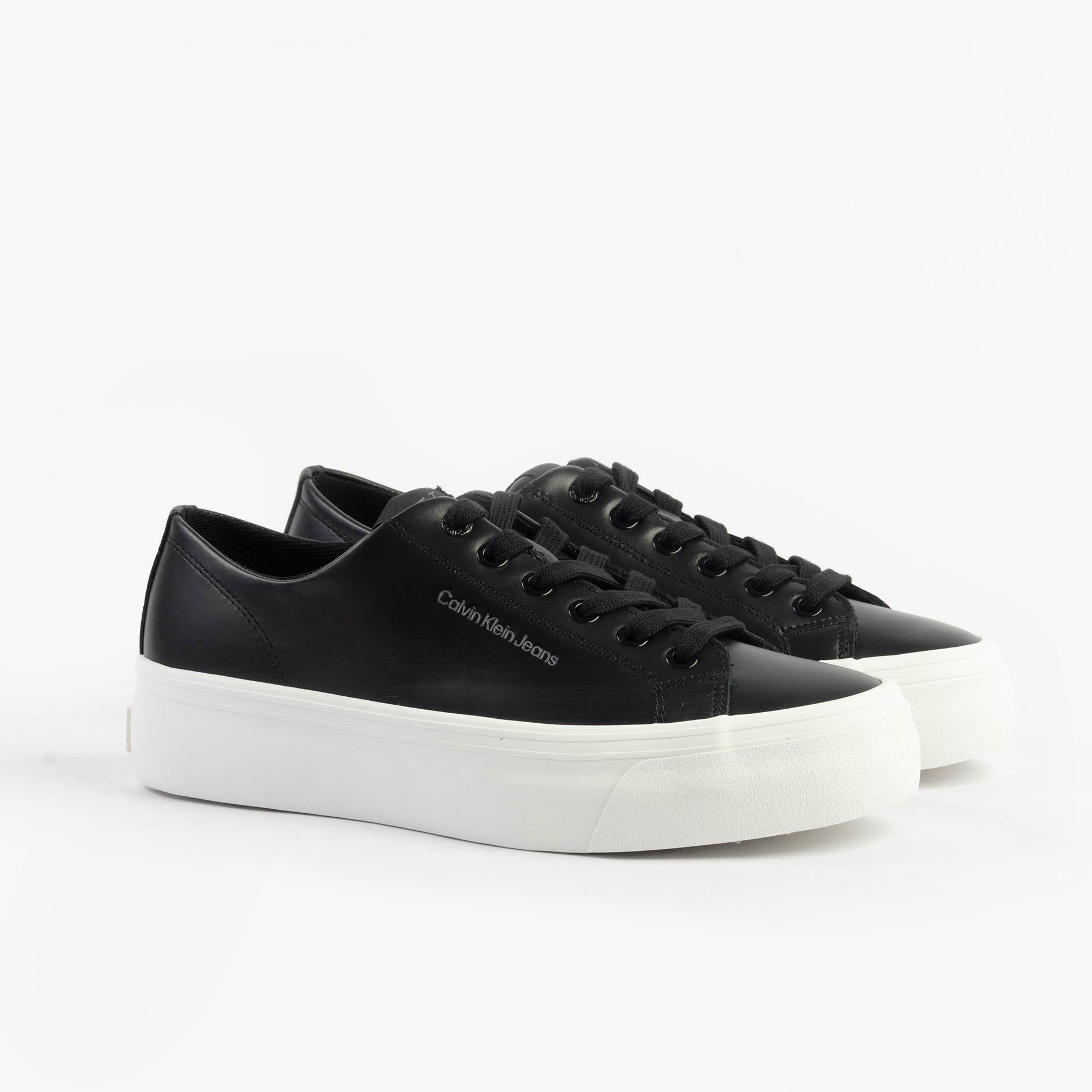 Calvin Klein VULC FLATFORM LOW Womens Trainers Black/Bright White side view with black leather upper and white platform sole.
