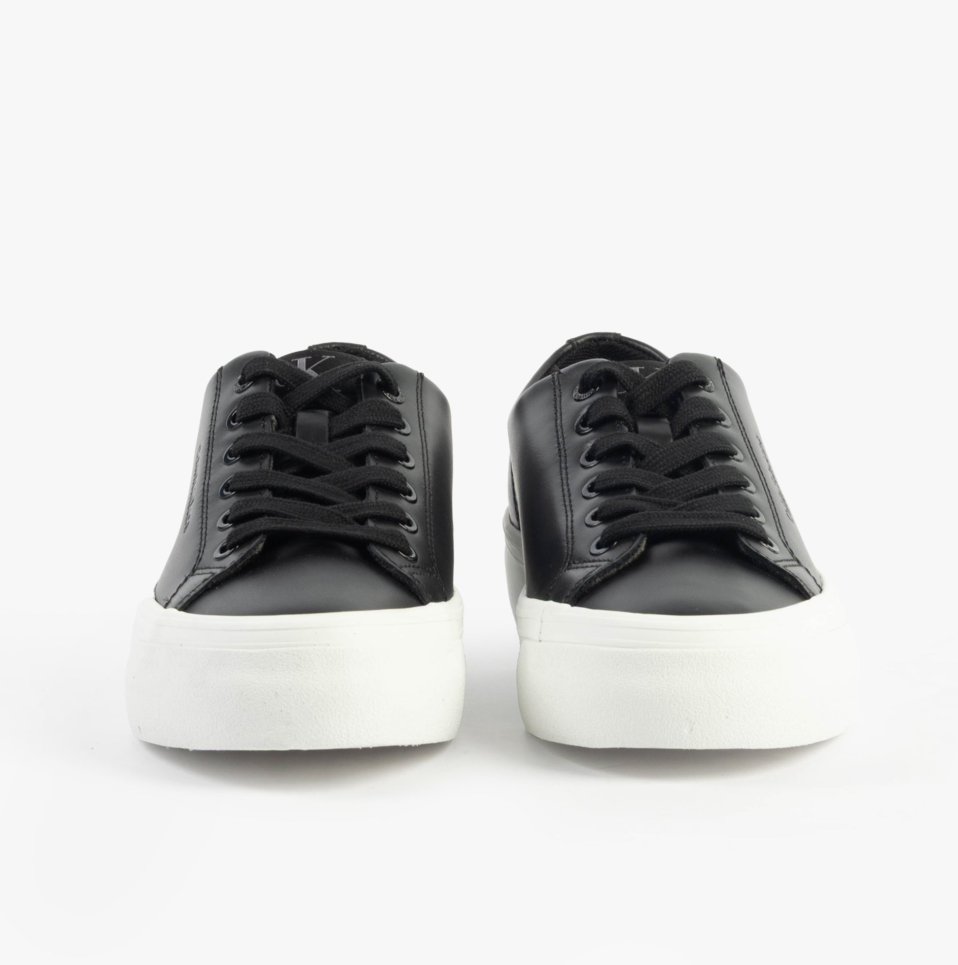 Calvin Klein VULC FLATFORM LOW Womens Trainers Black/Bright White front view showcasing lace-up design and platform sole.
