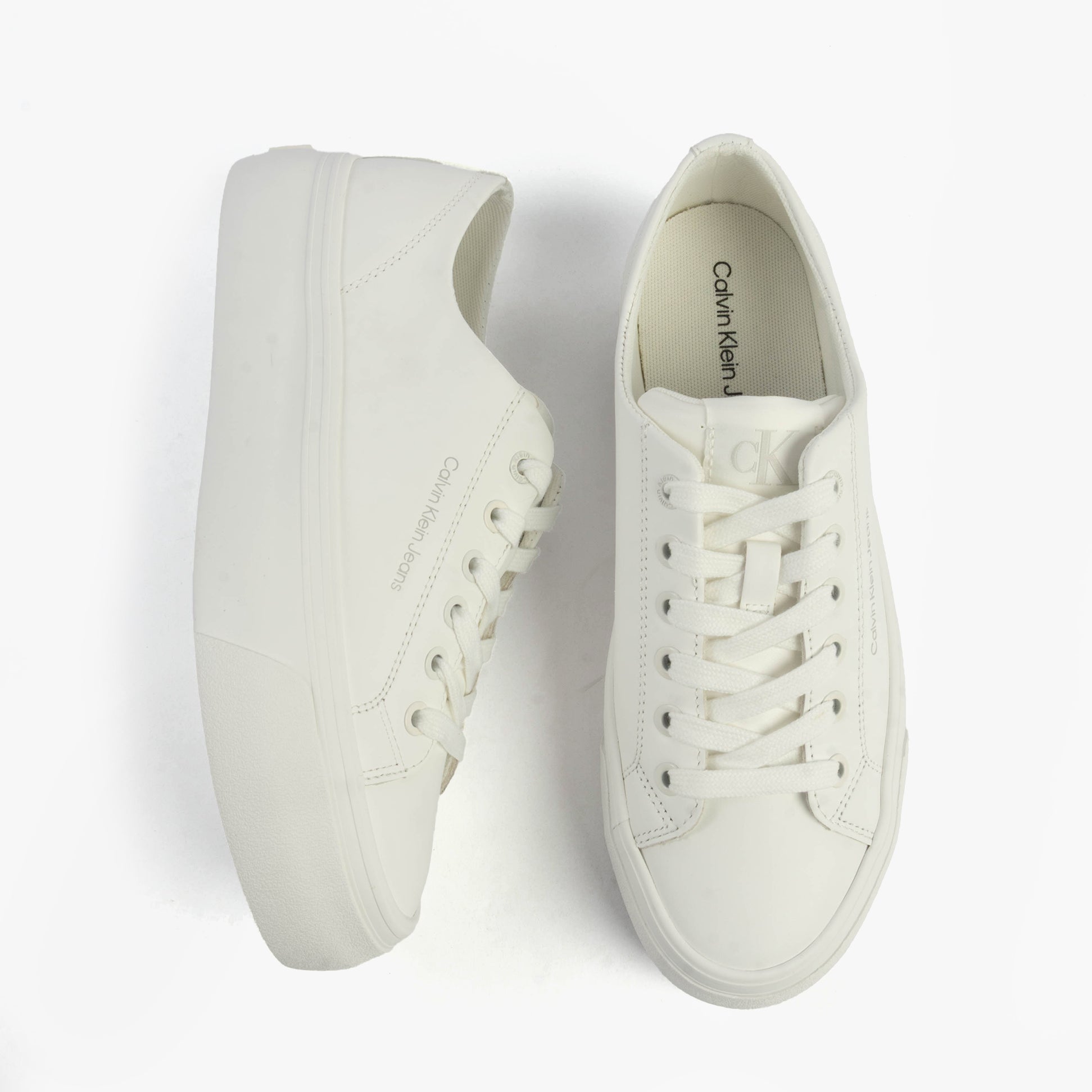Calvin Klein VULC FLATFORM LOW Womens Trainers Triple Bright White top view with lace-up closure and platform sole.