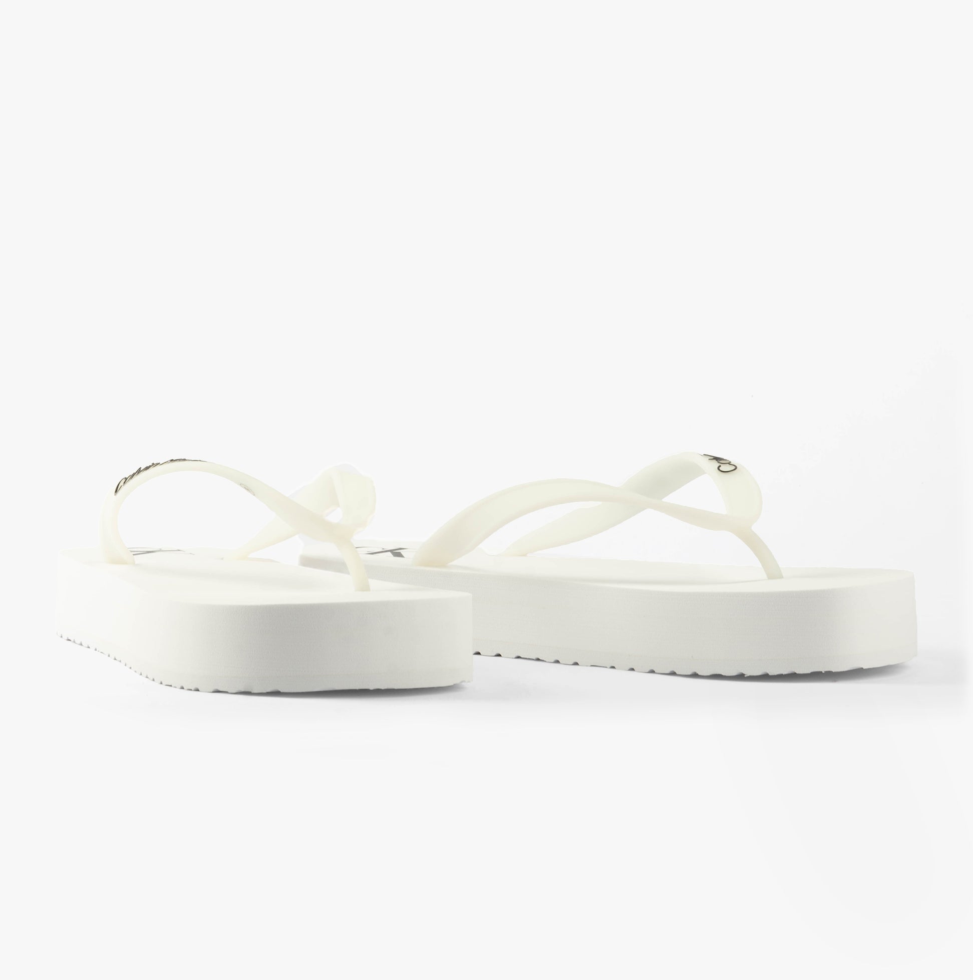 Calvin Klein BEACH SANDAL FLATFORM Womens Sandals Bright White/Black side view showcasing the flat platform design.