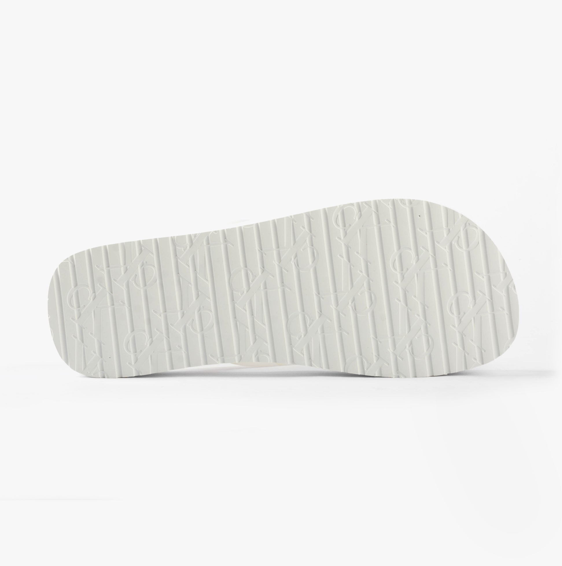 Calvin Klein BEACH SANDAL FLATFORM Womens Sandals Bright White/Black sole view with textured design.