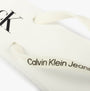 Calvin Klein BEACH SANDAL FLATFORM Womens Sandals Bright White/Black detail view of the sandal strap with branding