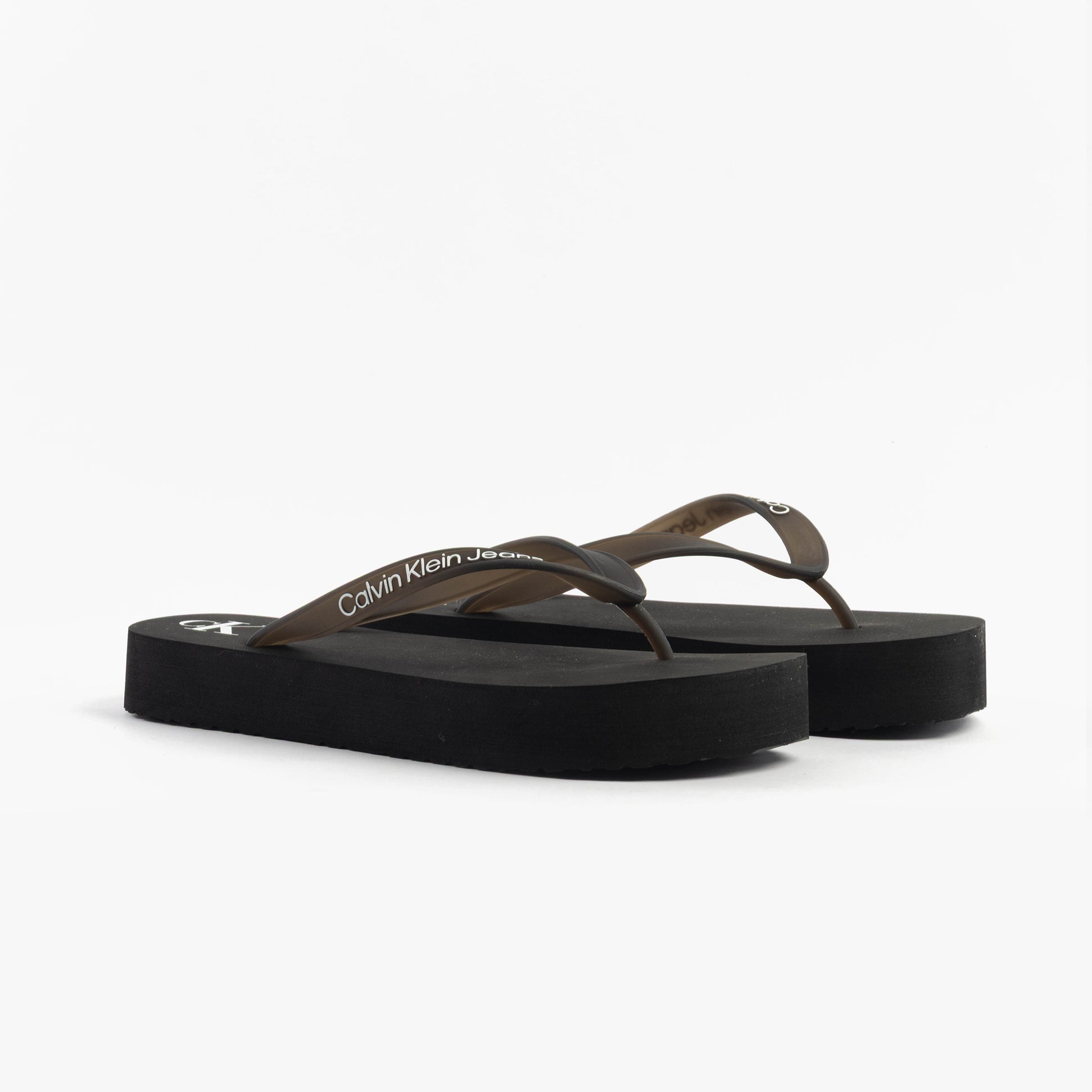 Calvin Klein BEACH SANDAL FLATFORM Womens Sandals Black/Bright White side view showing slip-on design and platform sole.