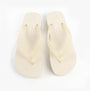 Calvin Klein BEACH SANDAL FLATFORM Womens Sandals Eggshell/Bright White top view showcasing the slip-on design.