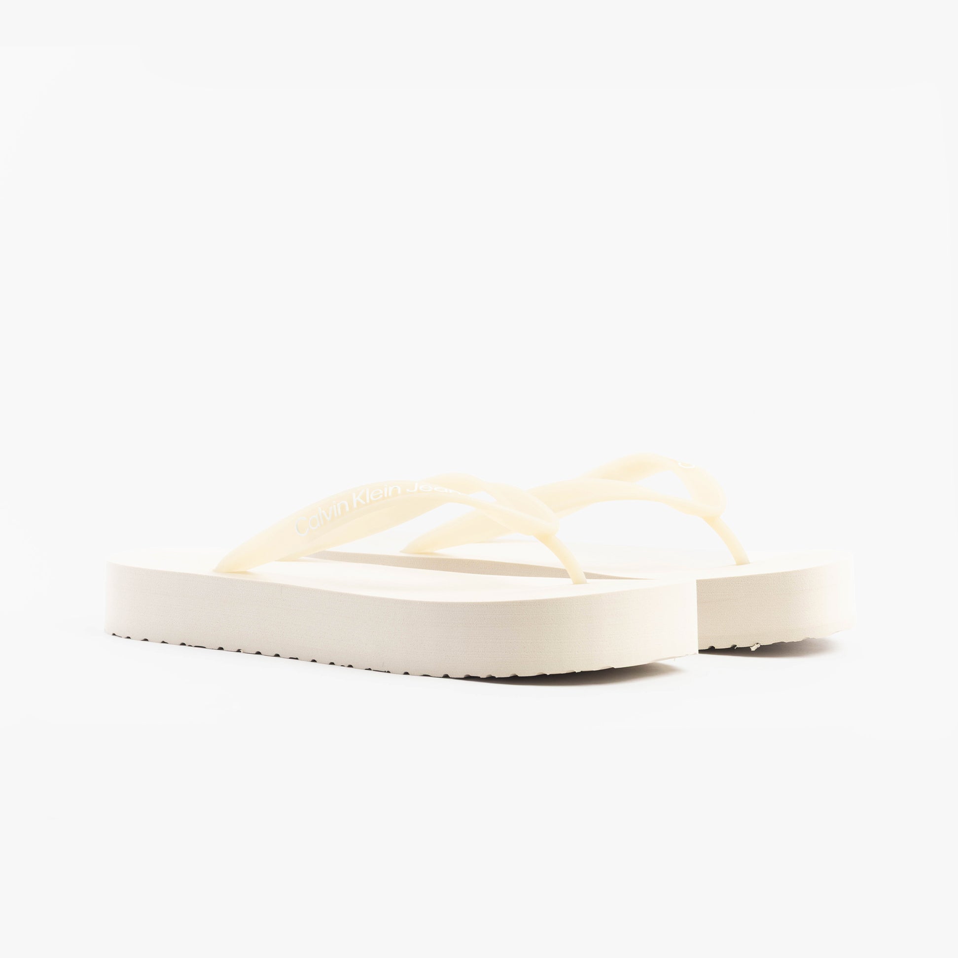 Calvin Klein BEACH SANDAL FLATFORM Womens Sandals Eggshell/Bright White side view of the sandals showing the platform heel.