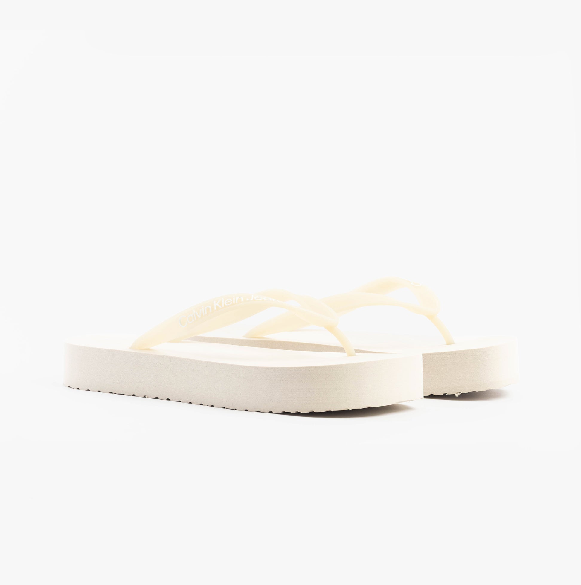 Calvin Klein BEACH SANDAL FLATFORM Womens Sandals Eggshell/Bright White side view of the sandals showing the platform heel.