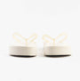 Calvin Klein BEACH SANDAL FLATFORM Womens Sandals Eggshell/Bright White rear view showing platform heel detail.