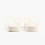 Calvin Klein BEACH SANDAL FLATFORM Womens Sandals Eggshell/Bright White rear view showcasing the flat platform design.