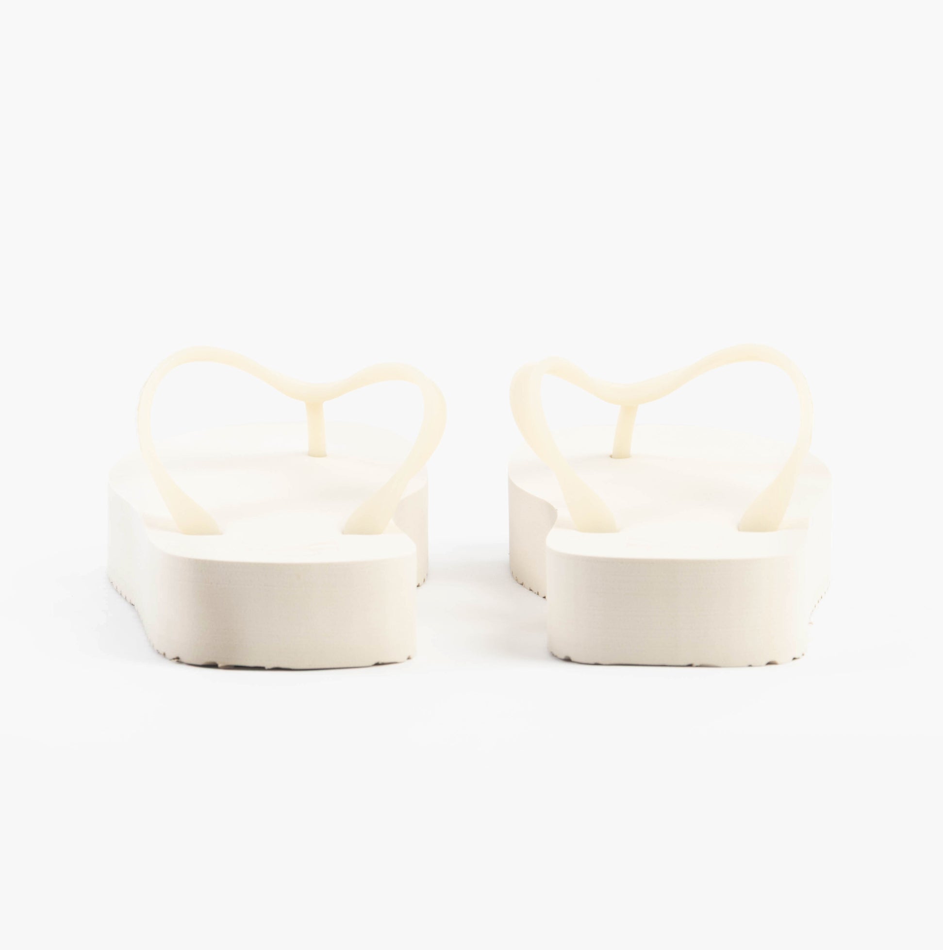 Calvin Klein BEACH SANDAL FLATFORM Womens Sandals Eggshell/Bright White rear view showcasing the flat platform design.