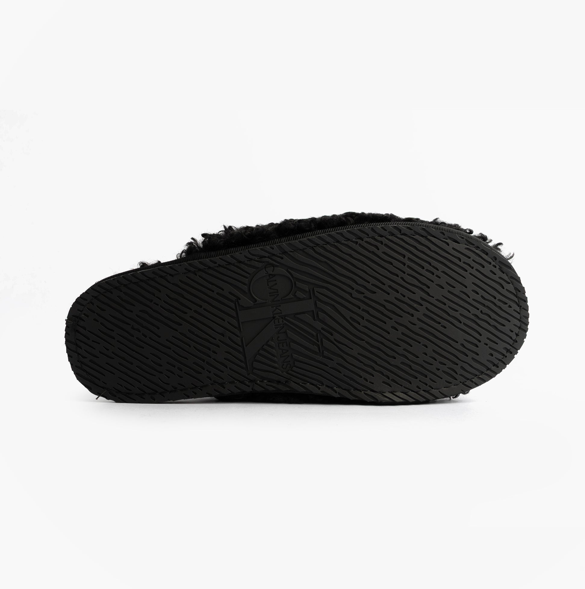 Calvin Klein CLOSE SLIPPER FUR Womens Slippers Black bottom view showcasing textured sole design.