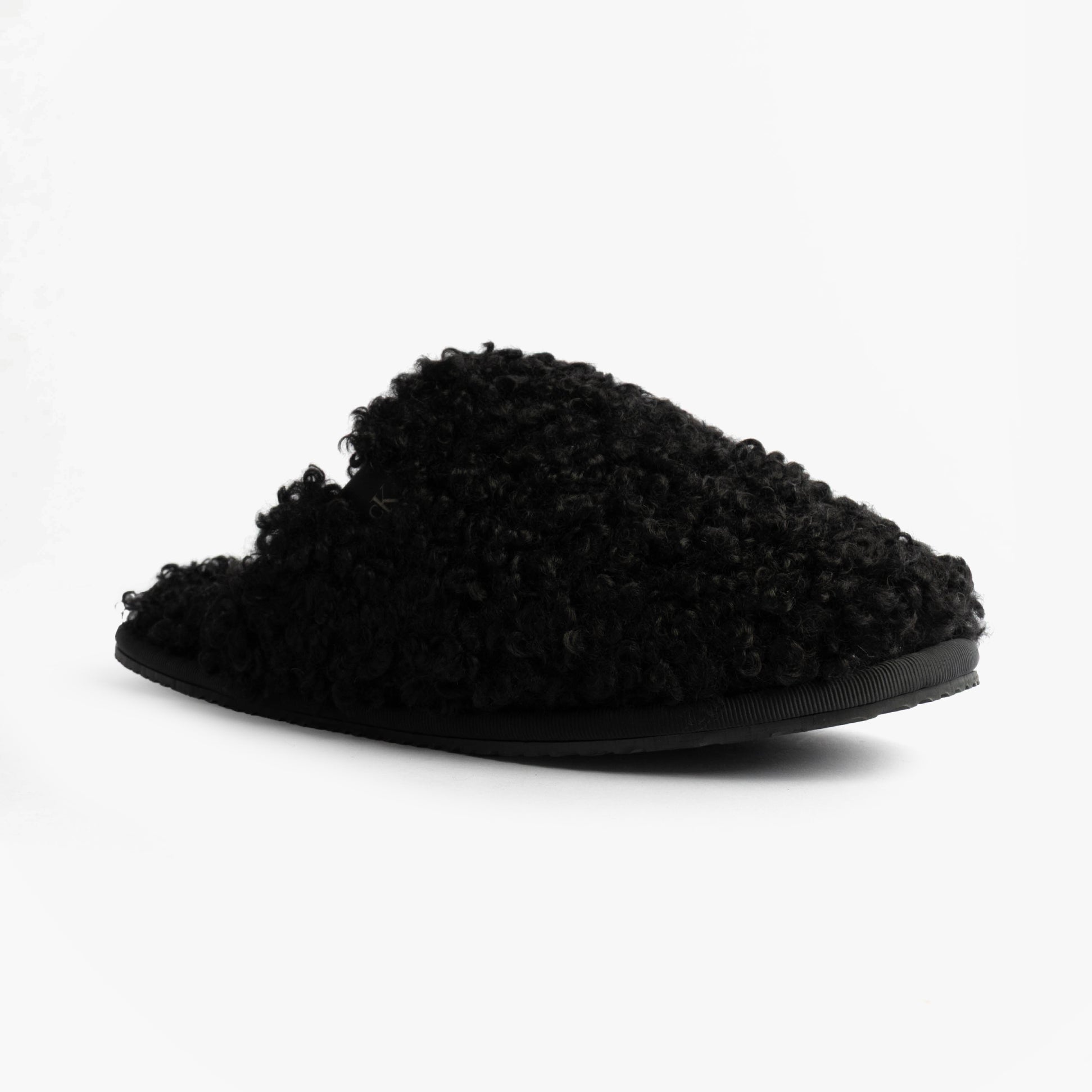 Calvin Klein CLOSE SLIPPER FUR Womens Slippers Black side view showing faux fur upper and flat sole.